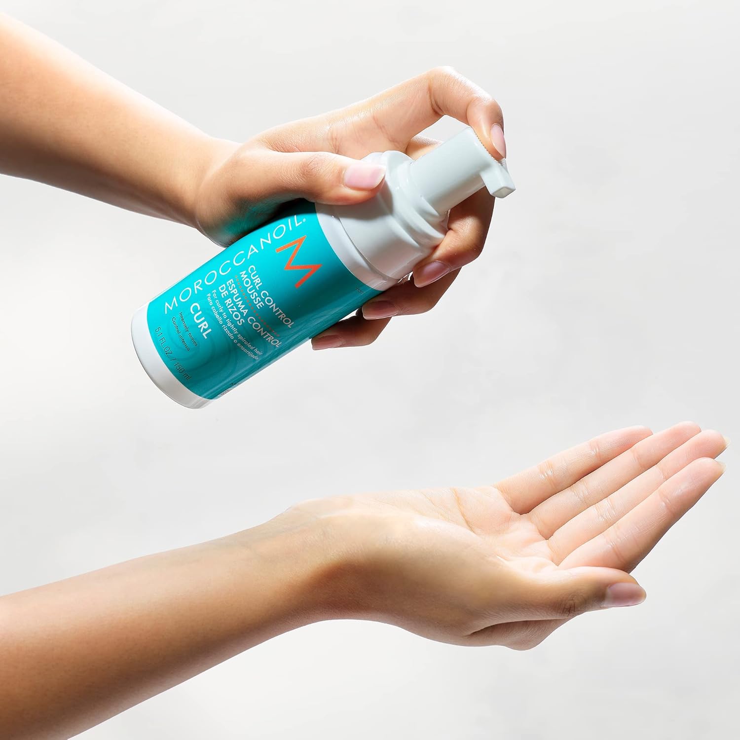 Elefair Moroccanoil Curl Control Mousse in 5.1 oz bottle, showcasing the product designed to define and hold curly hairstyles.