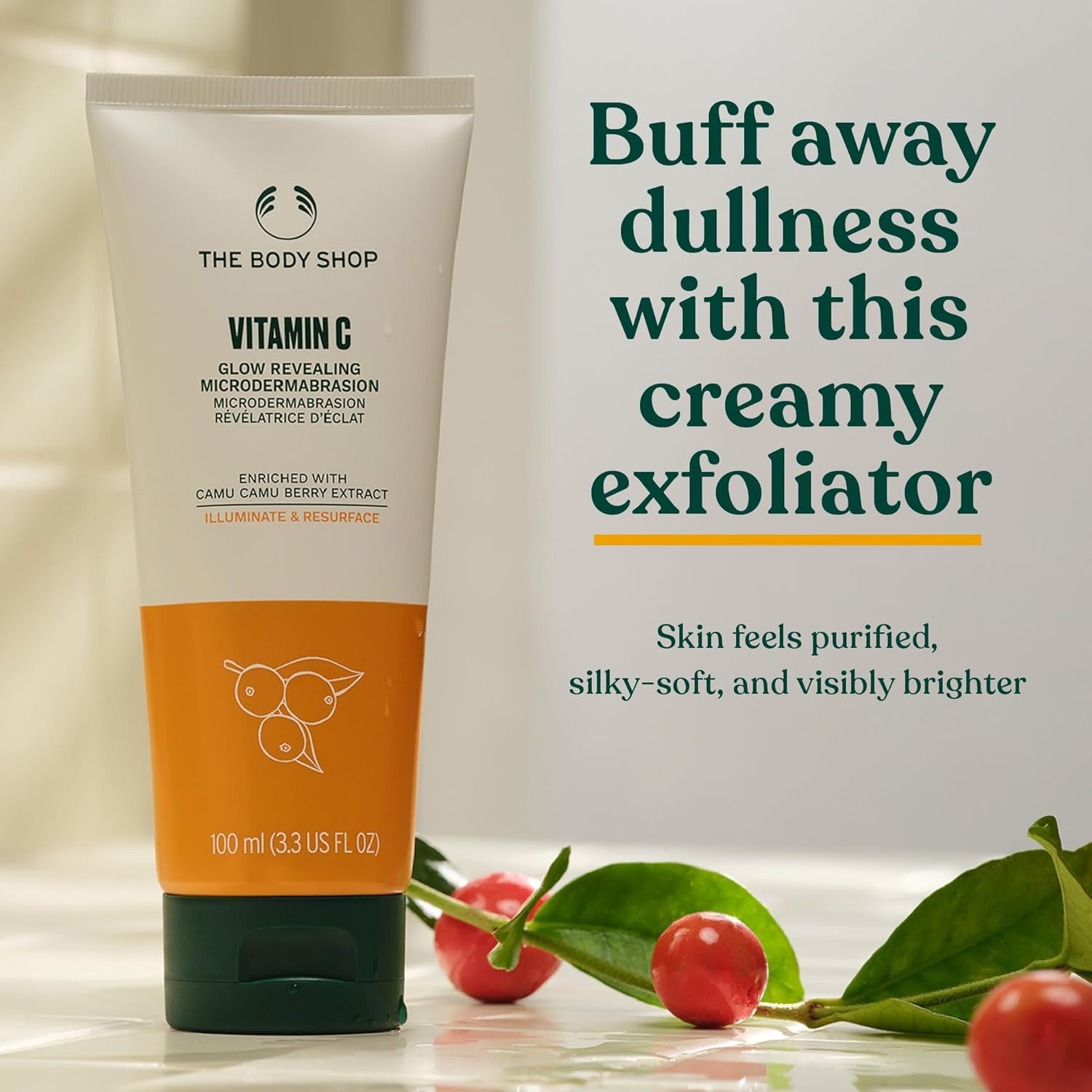 The Body Shop Vitamin C Glow Boosting Microdermabrasion exfoliates dull skin, showcasing the 100ml vegan skincare product.