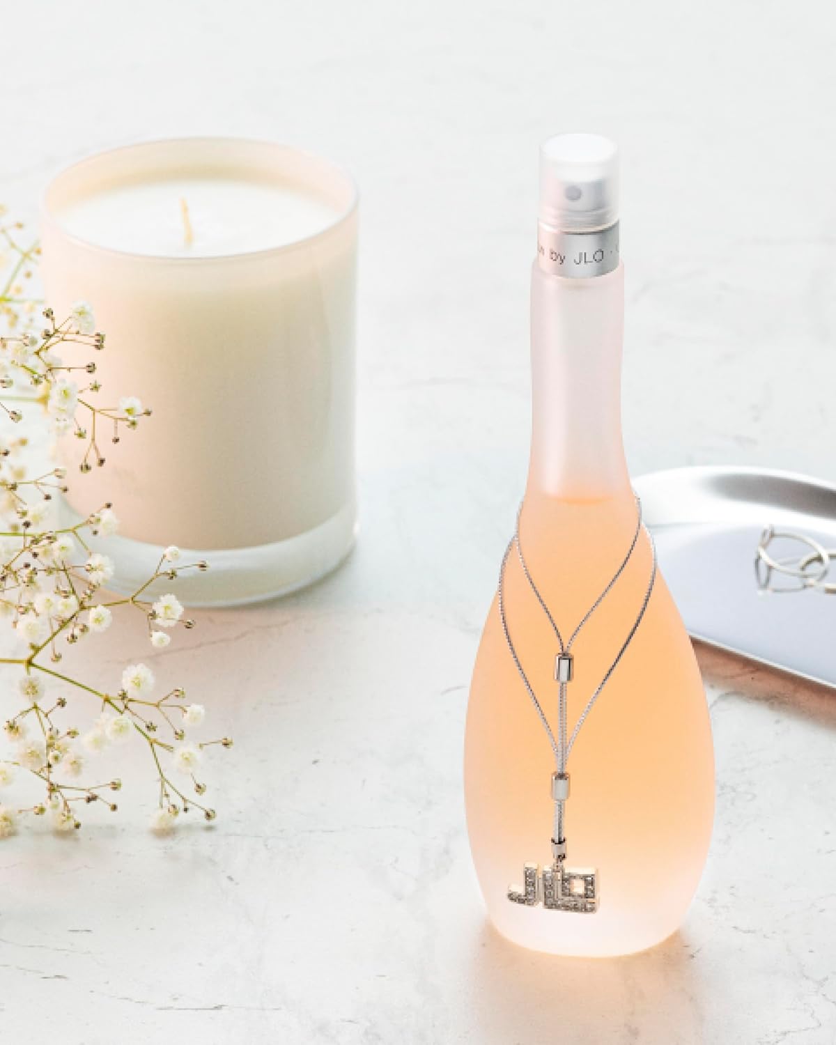 Jennifer Lopez Glow women's 5 oz EDT spray bottle, elegant glass container with gold accents, showcasing the fragrance.