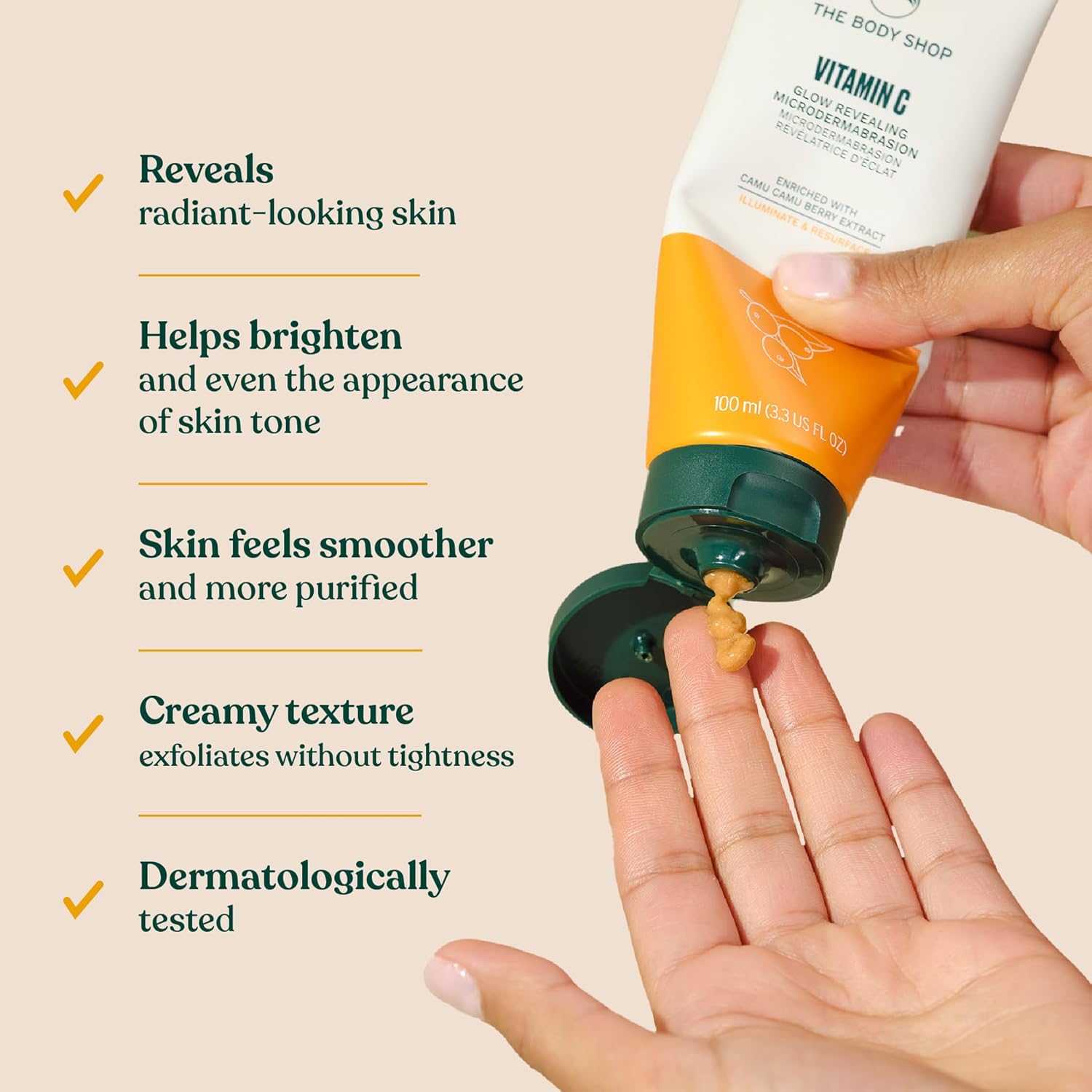 The Body Shop Vitamin C Glow Boosting Microdermabrasion cream for exfoliating tired, dull skin in a 100ml jar.