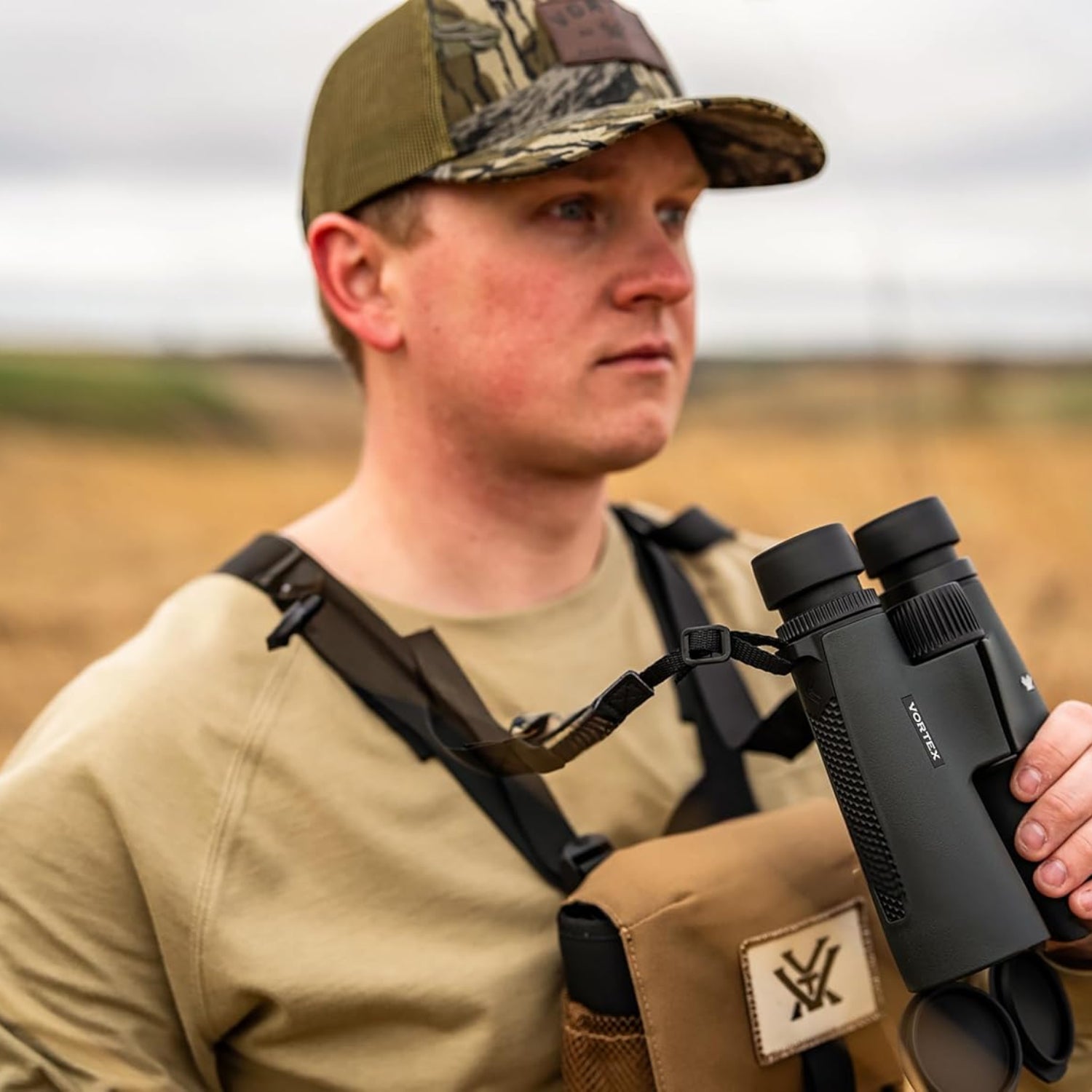 Elefair Vortex Triumph HD 12x50 binoculars showing black body, textured grip, and eyepieces, shock resistant and tripod mountable