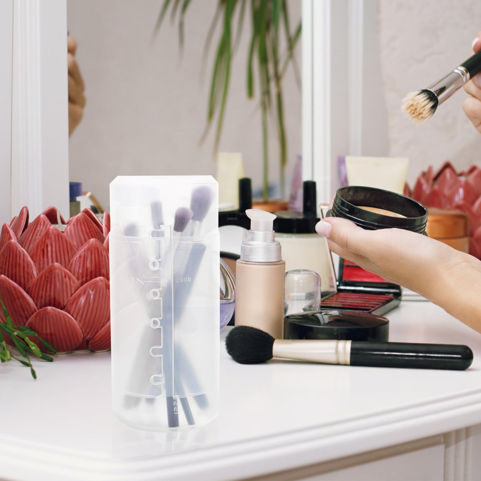 FOYTOKI makeup brush holder caddy with lid, 3-piece retractable plastic organizer cups for travel and vanity storage.