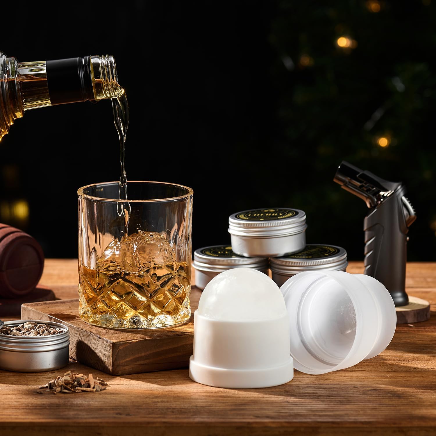 ComboJoy whiskey smoker kit with torch, 6 wood chip flavors, 2 glasses, and 2 ice ball molds for flavorful whiskey sipping.