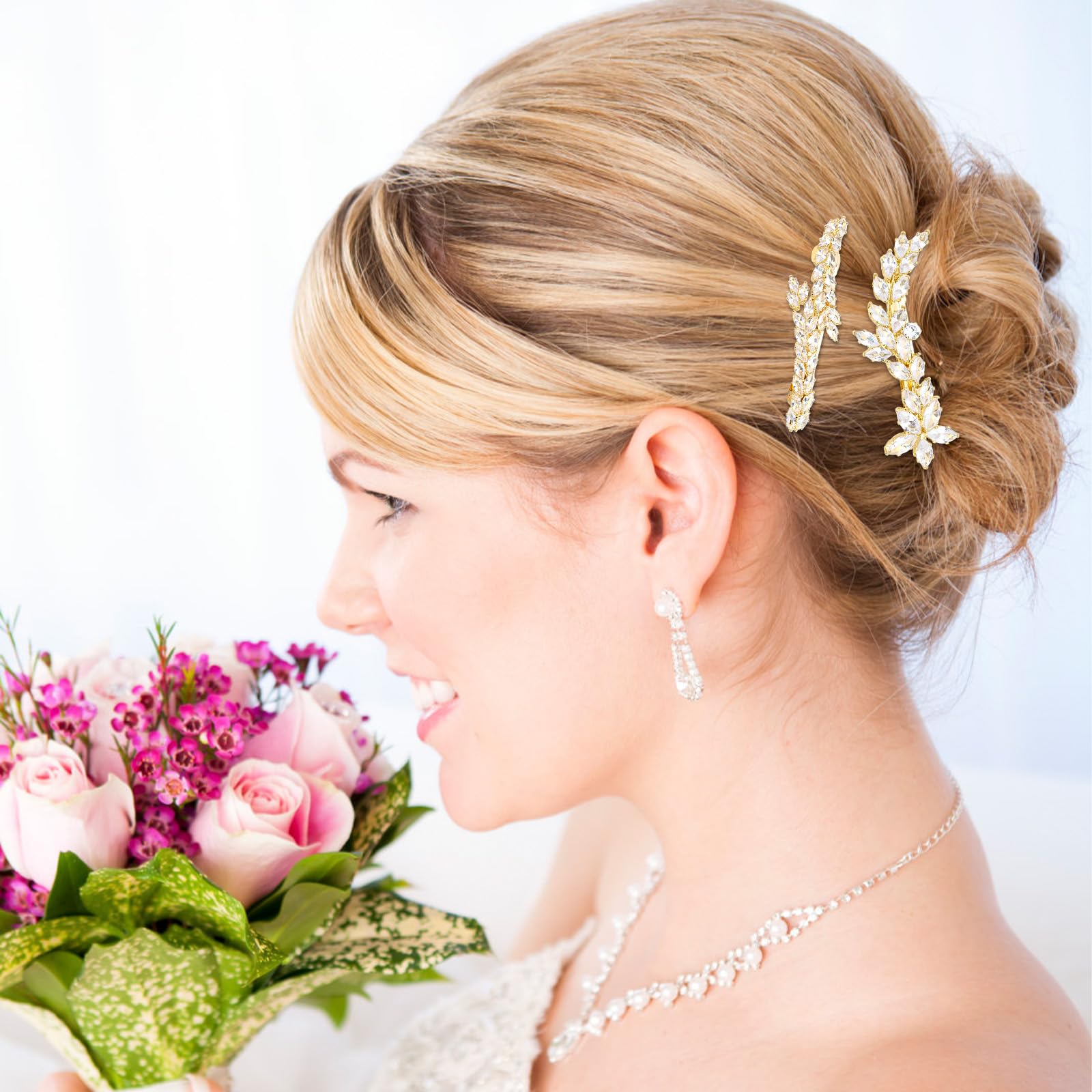 ANBALA 2-piece gold rhinestone leaf hair clips for women, perfect for wedding hairstyles and elegant hair accessories.