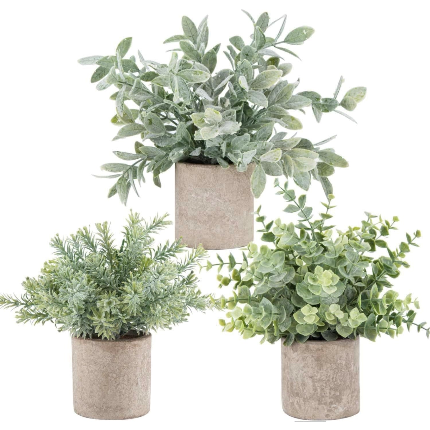 Three artificial plants in beige pots on a white background