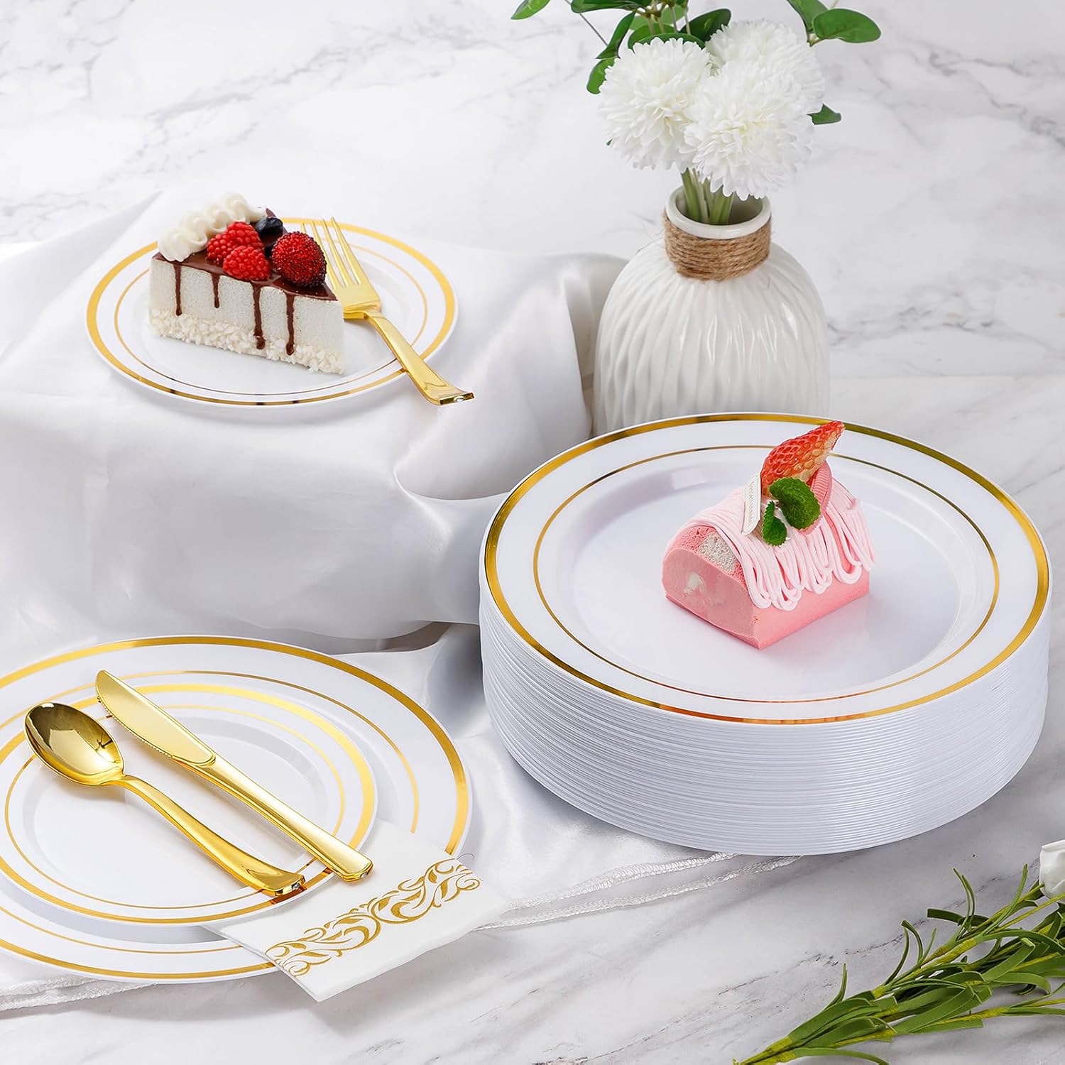 Goodluck 700-piece gold disposable dinnerware set for 100 guests, including plates, cups, and utensils for parties.