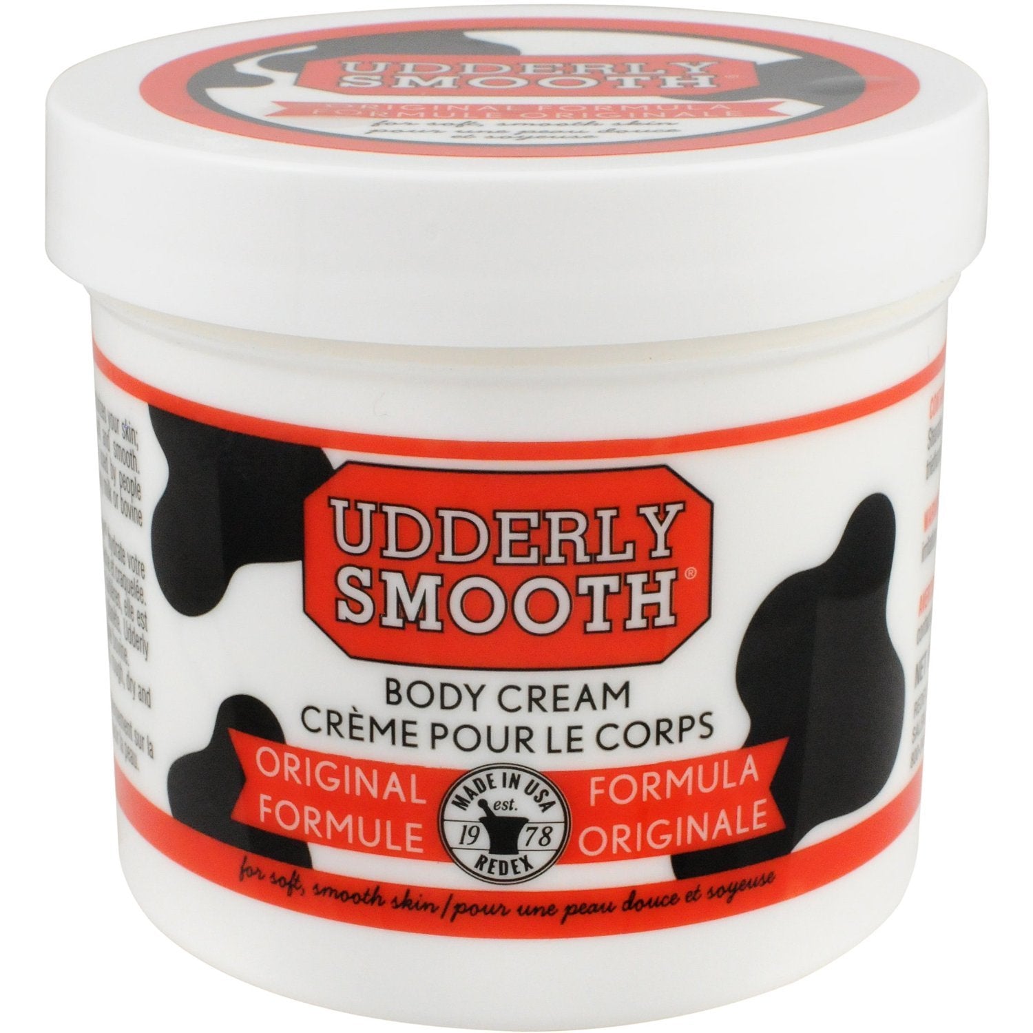 Set of six Udderly Smooth body cream jars, moisturizing skin lotion with gentle, smooth texture for soft, hydrated skin.