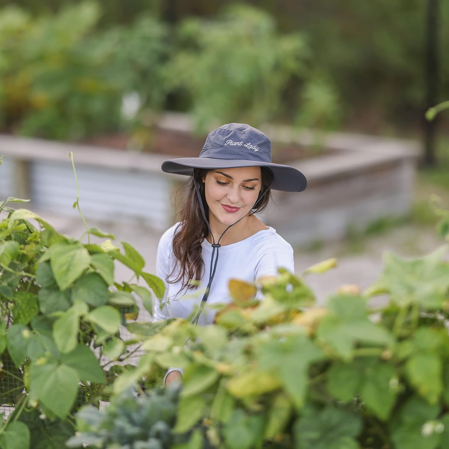 Laila and Lainey Plant Lady wide brim waterproof gardening hat for women, green sun hat with a floral design for gardening.