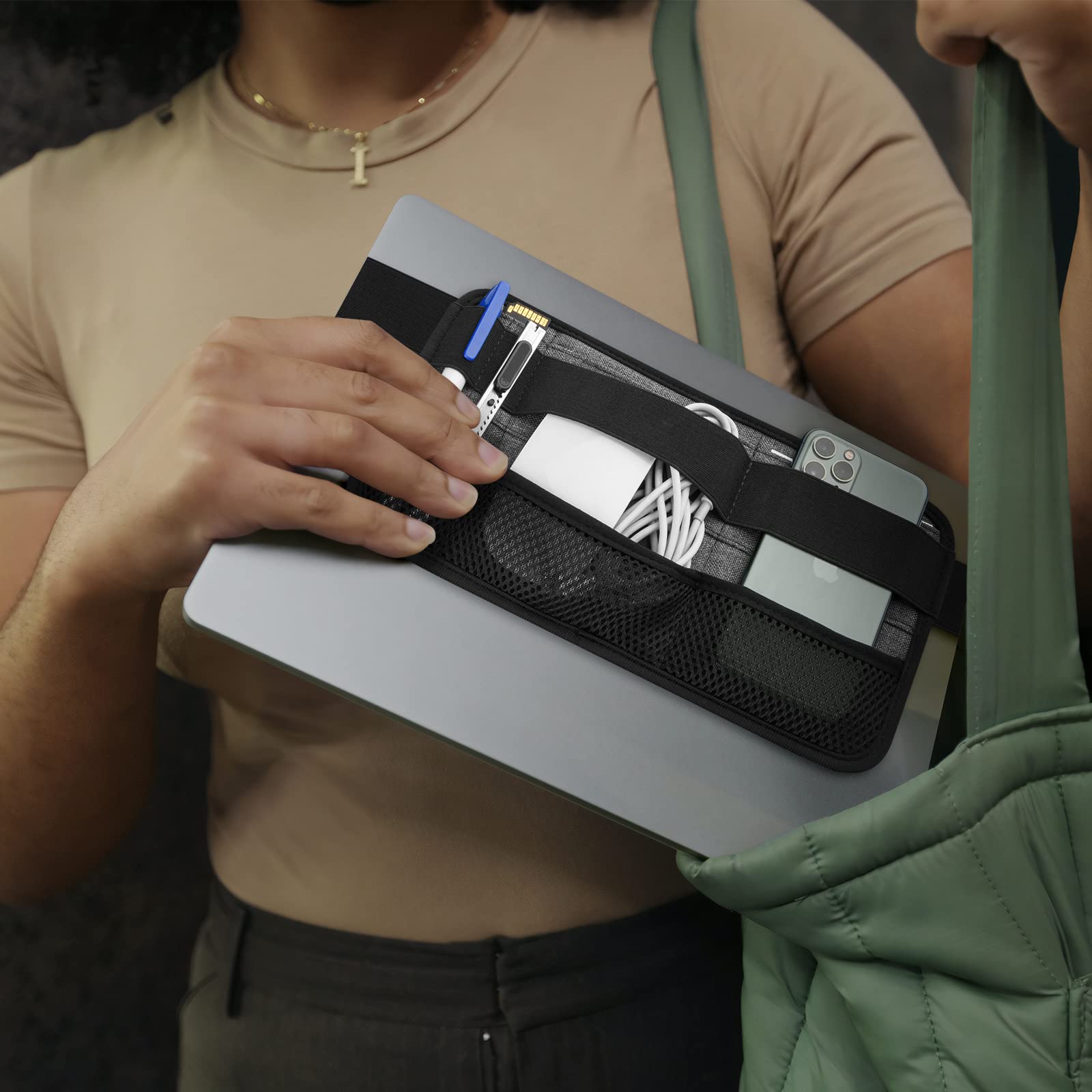 Gray Homakover portable tech organizer caddy attached to a laptop, holding cables, mouse, power bank, USB adapters, and chargers.