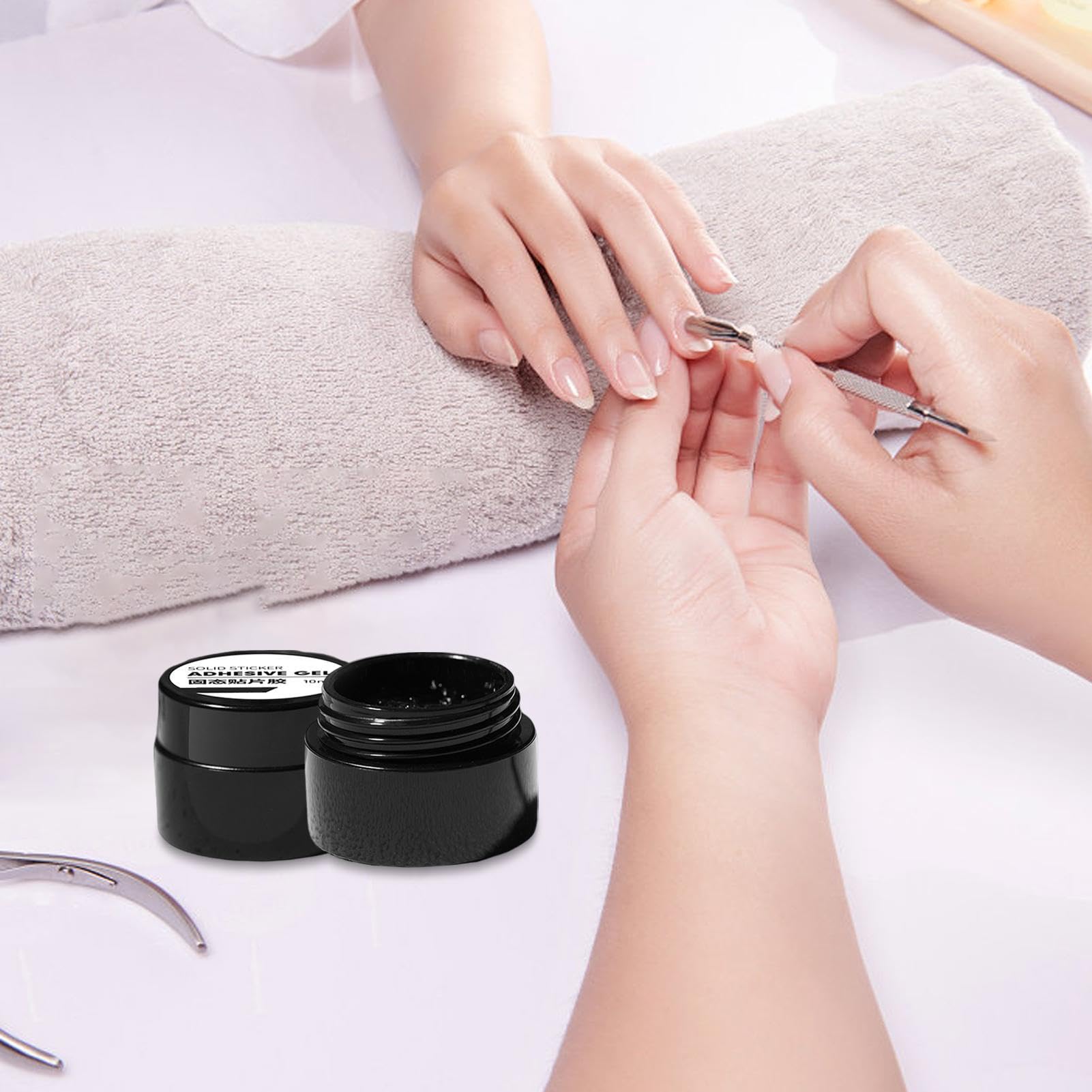 Guyuati Nail Adhesive Gel in 10ml bottle, strong hold bonding gel for press-on and faux nails, clear and easy to apply.