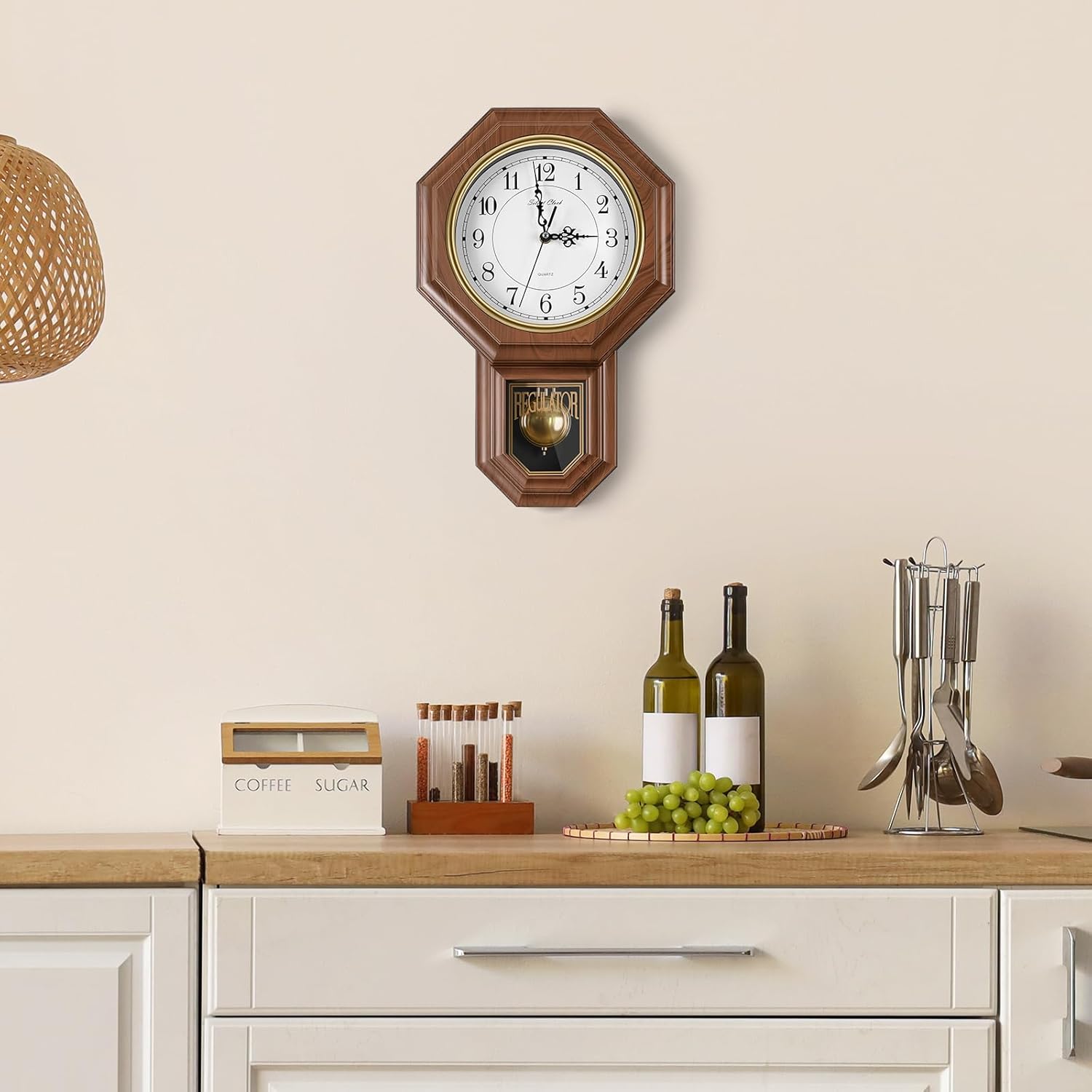 KANEODOT battery-operated pendulum wall clock with imitation wood plastic case and traditional regulator clock design.