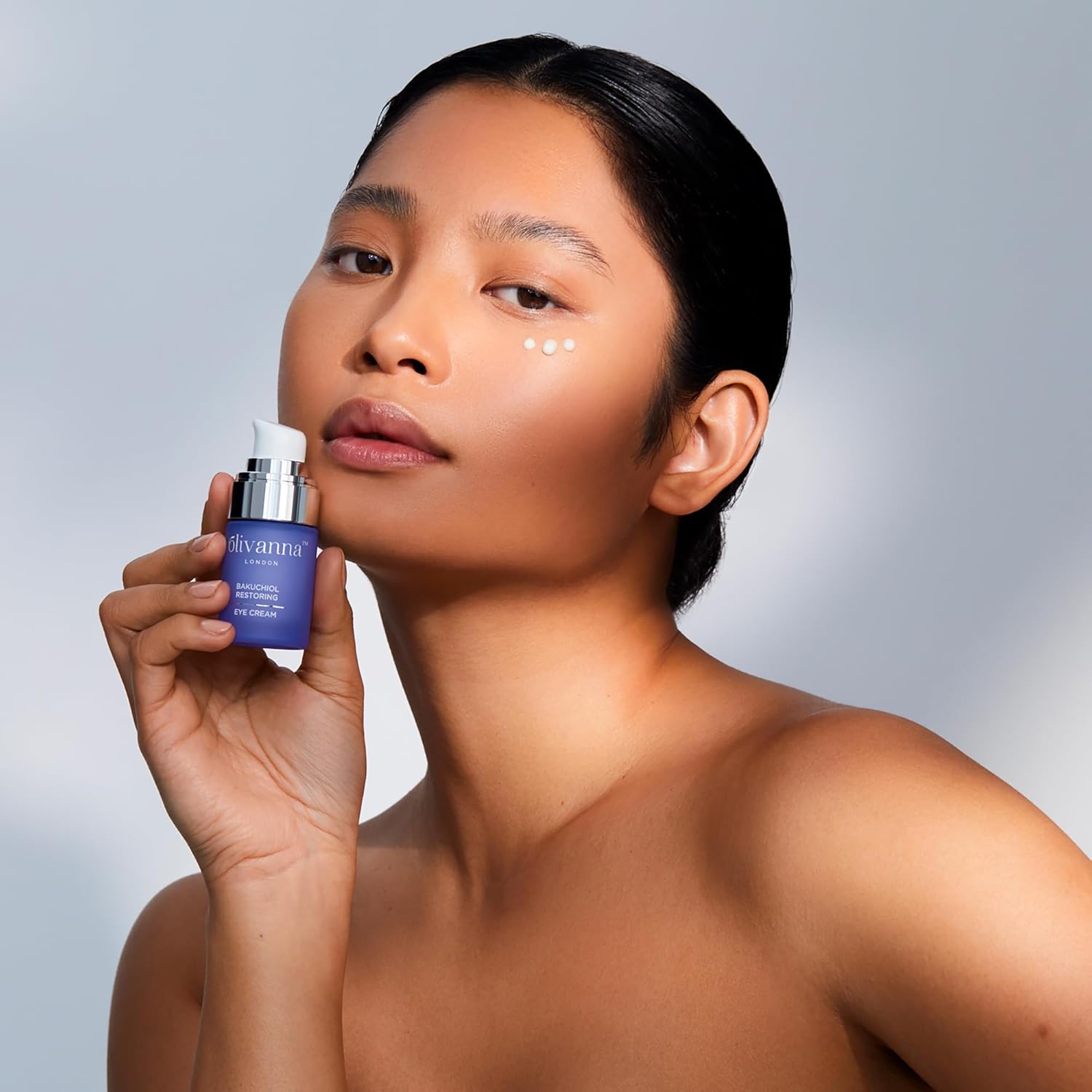 Olivanna Bakuchiol Restoring Eye Cream with elderflower extract, showing the cream in a jar for reducing eye area visibility.