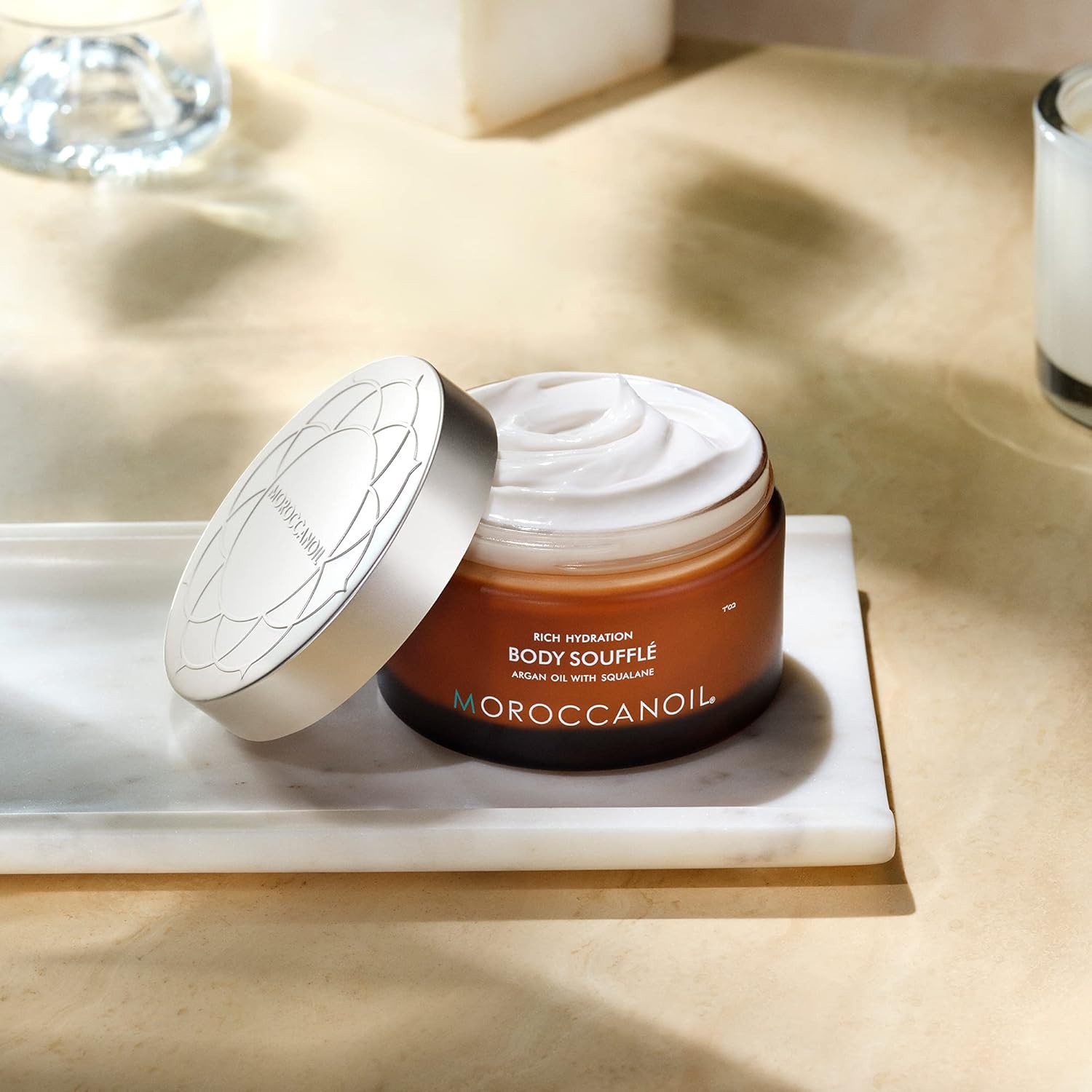 Moroccanoil Body Soufflé Originale in 6.7 Fl Oz jar, featuring a creamy, luxurious body moisturizer with a soft fragrance.