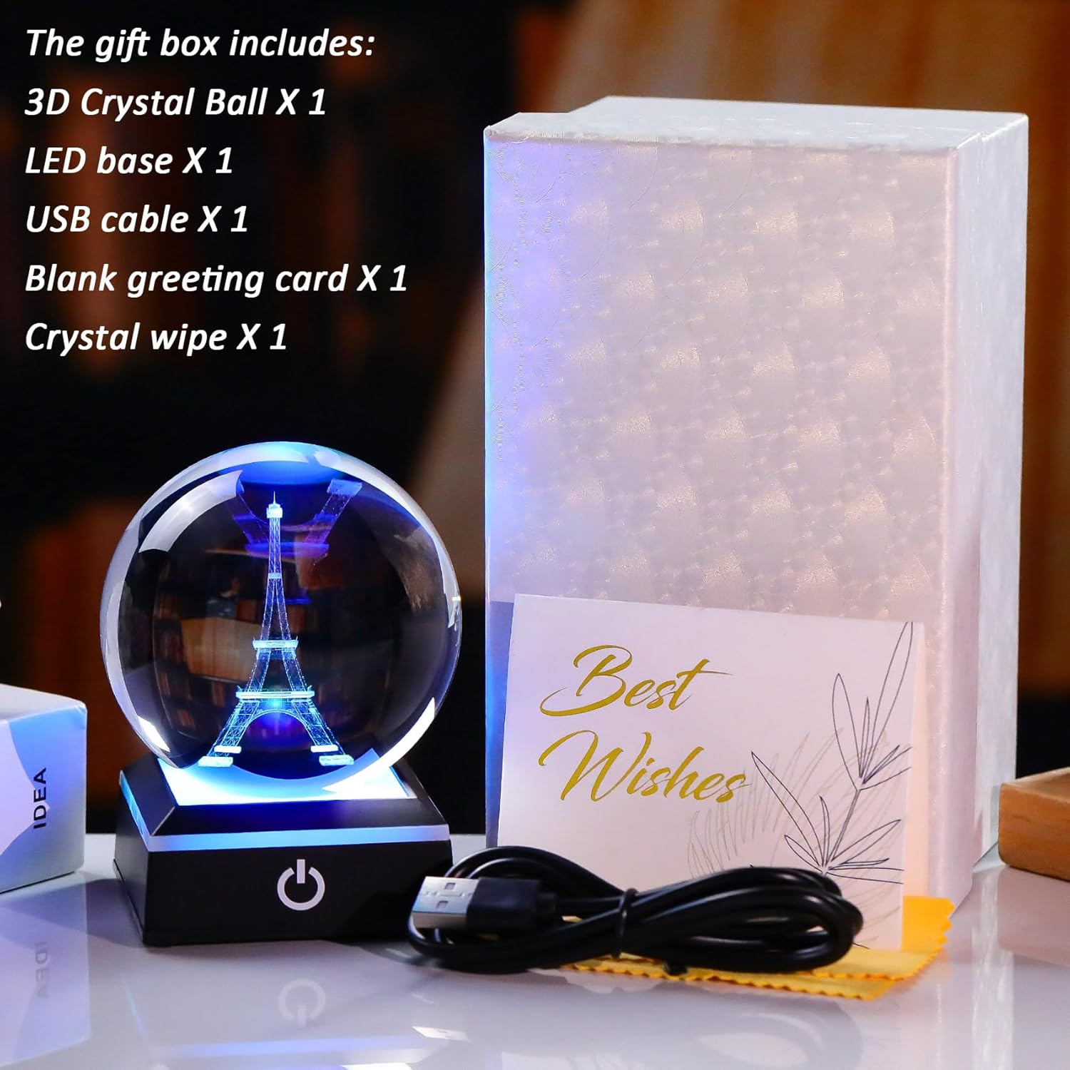 Enjinkail 3D crystal snow globe featuring Paris Eiffel Tower, decorative glass ornament with snowy scene and intricate details.