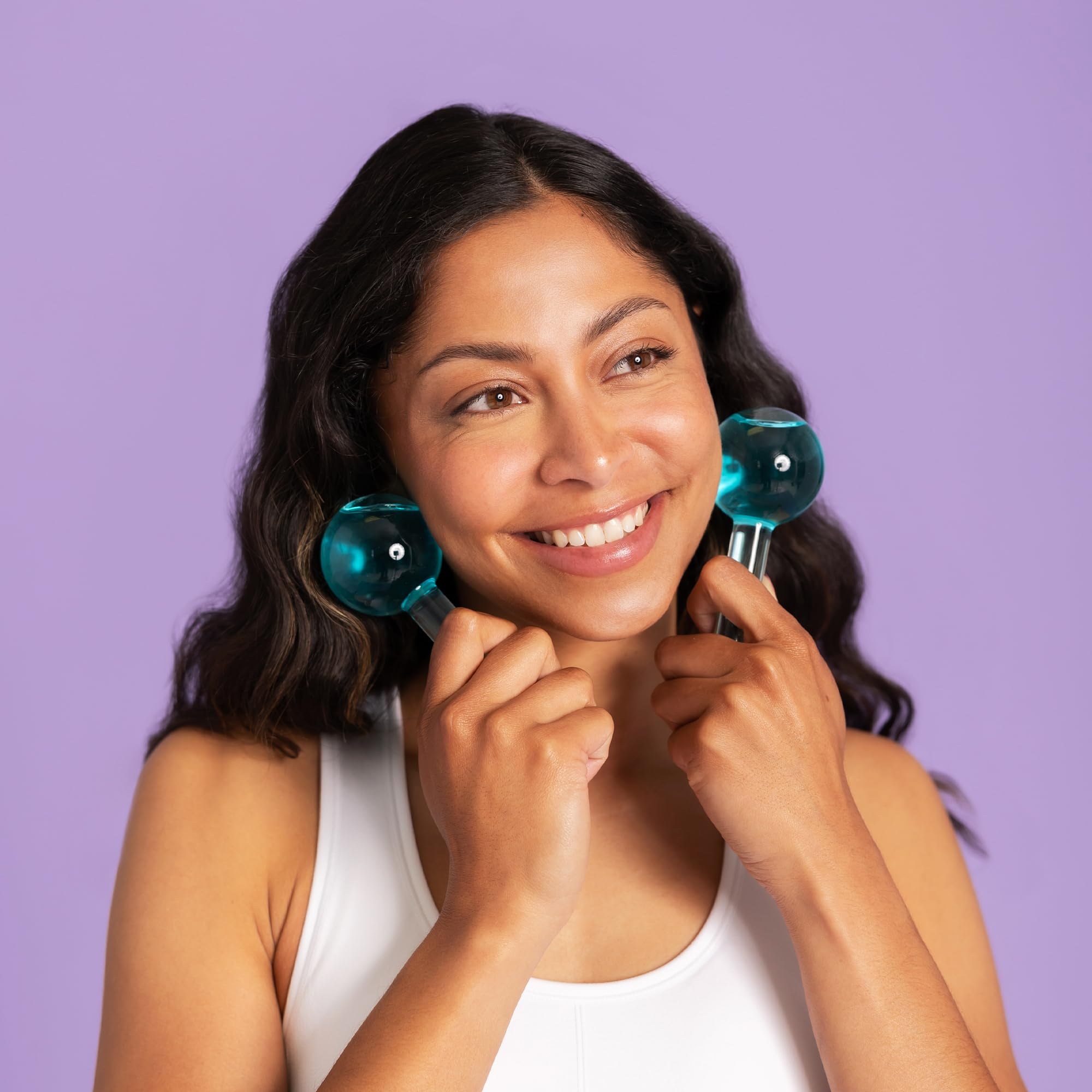Plum Beauty Gua Sha and ice globes face massager set showing a wooden Gua Sha tool and glass ice globes for facial massage.