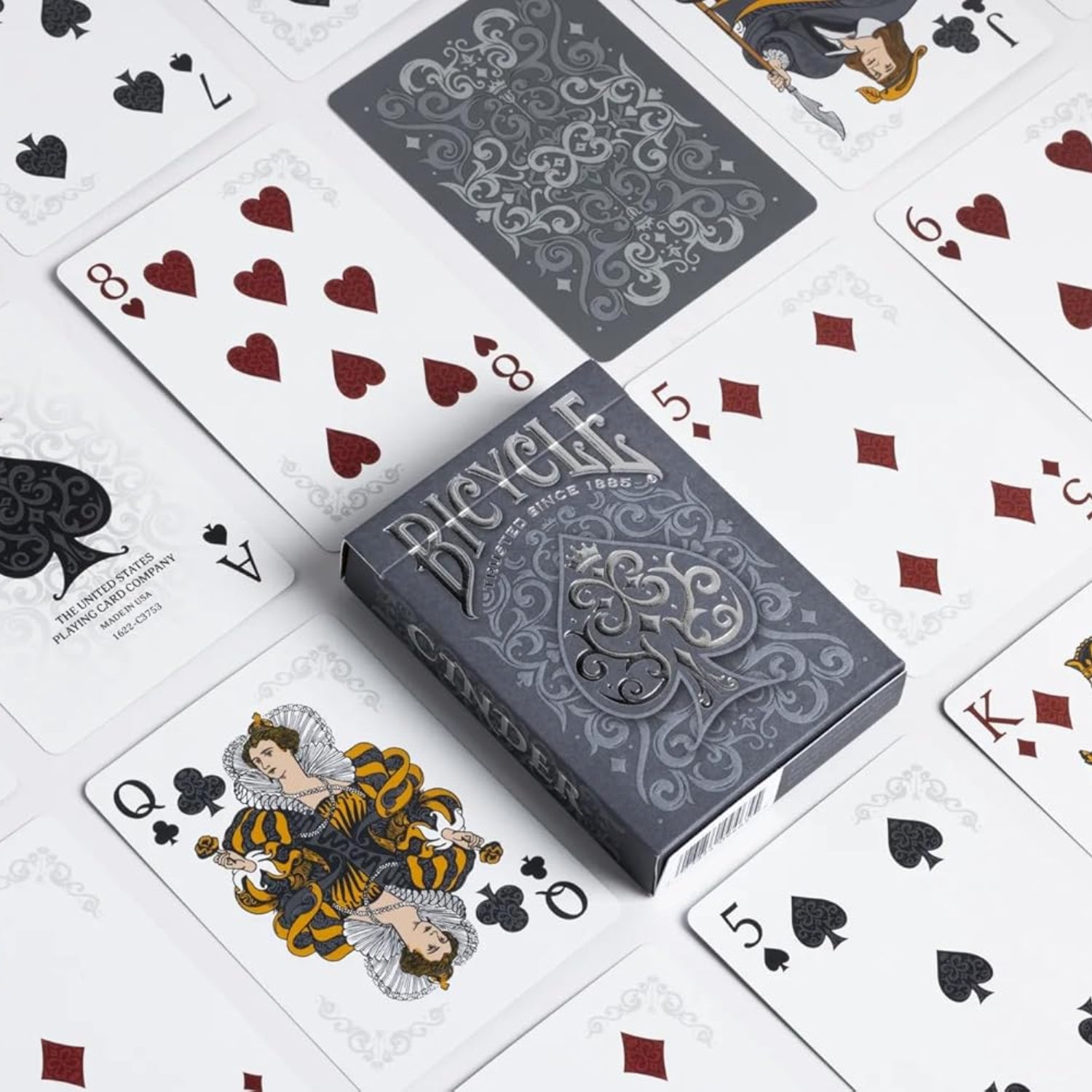 Bicycle Cinder Premium playing cards deck with silver smoke foil design, featuring standard playing card faces and back.