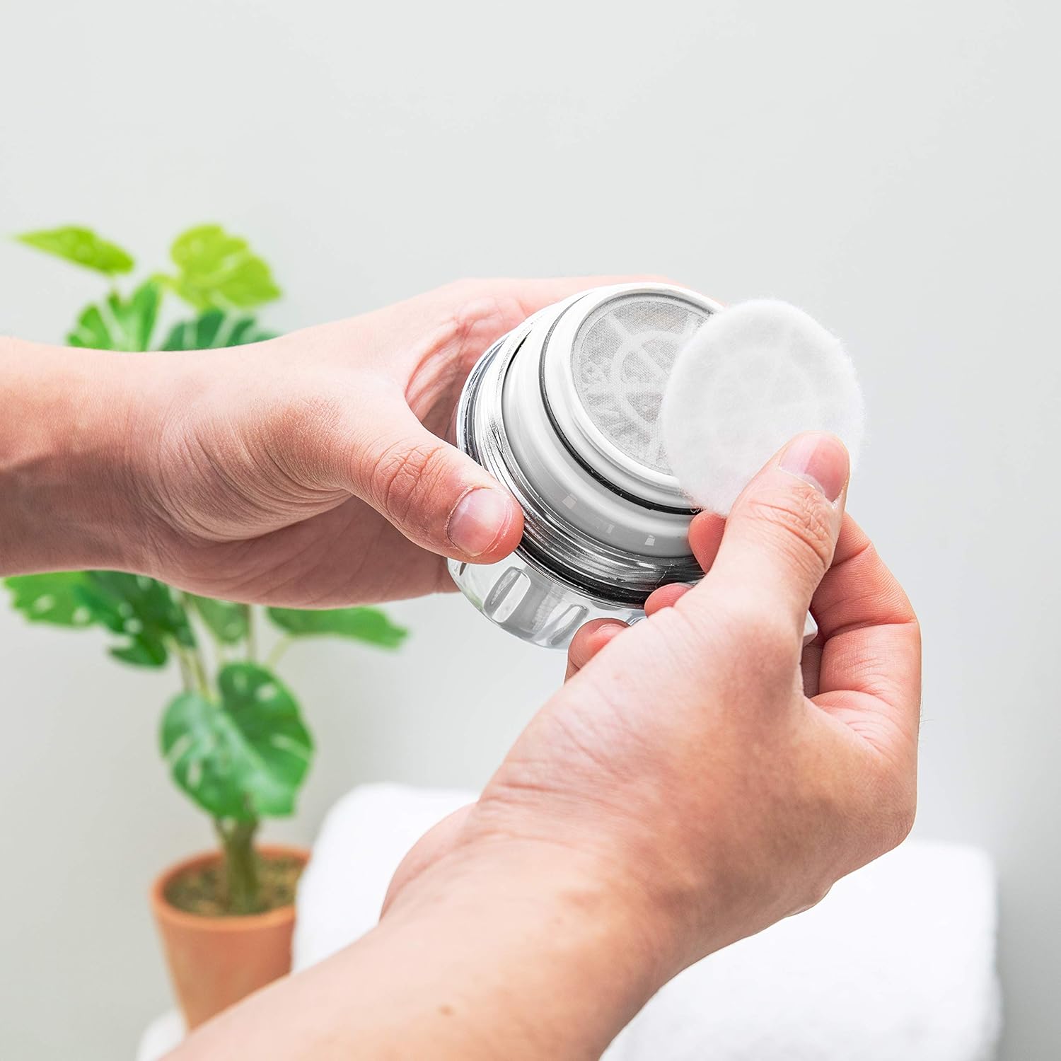 AquaBliss heavy-duty shower filter attached to a showerhead, showcasing its durable design and advanced 30x water filtration system.