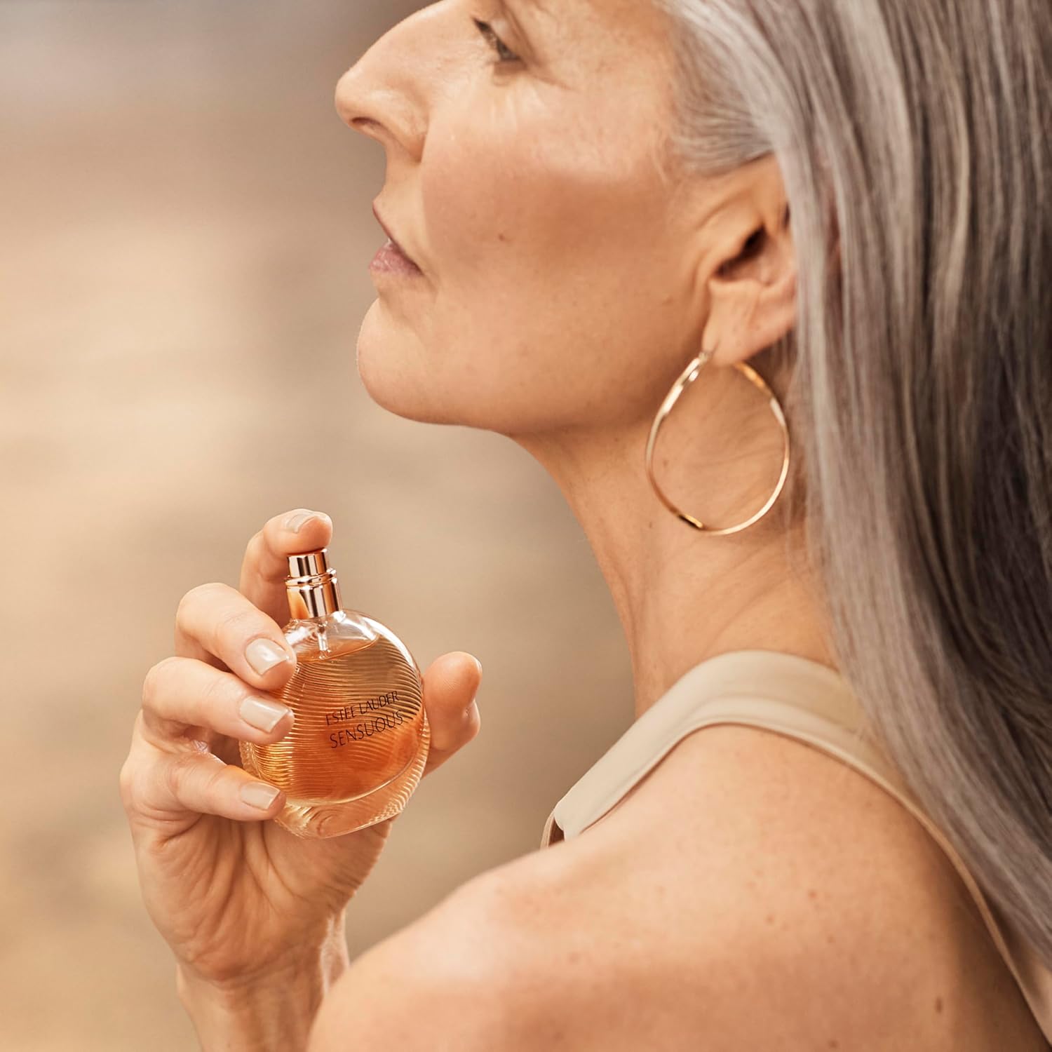 Estée Lauder Sensuous Eau de Parfum spray with sandalwood, honey, and mandarin notes, 1.7 fl oz, for women.