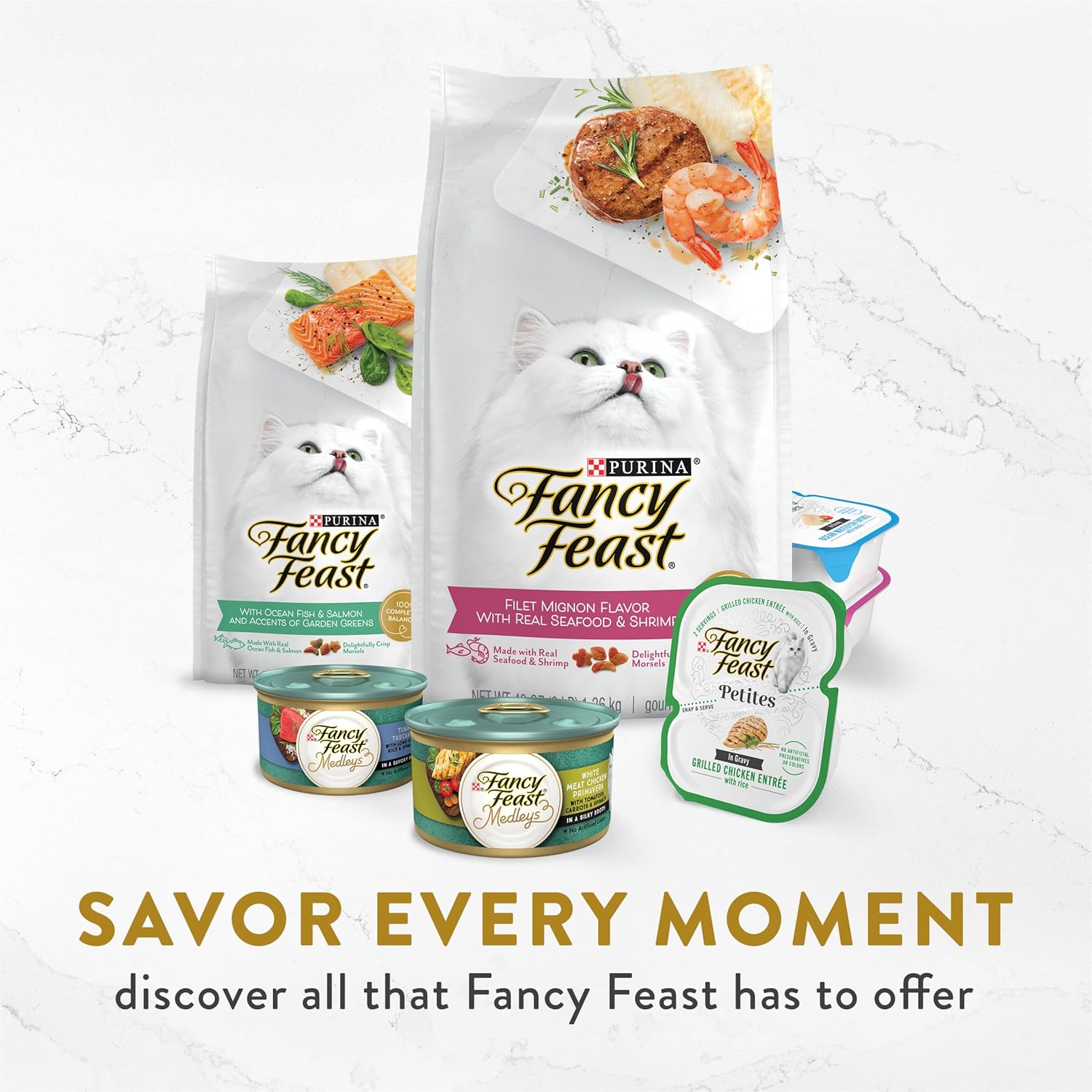 Fancy Feast Purina cat food broth topper with seafood bisque and accents, served in a clear dish with fresh seafood pieces.