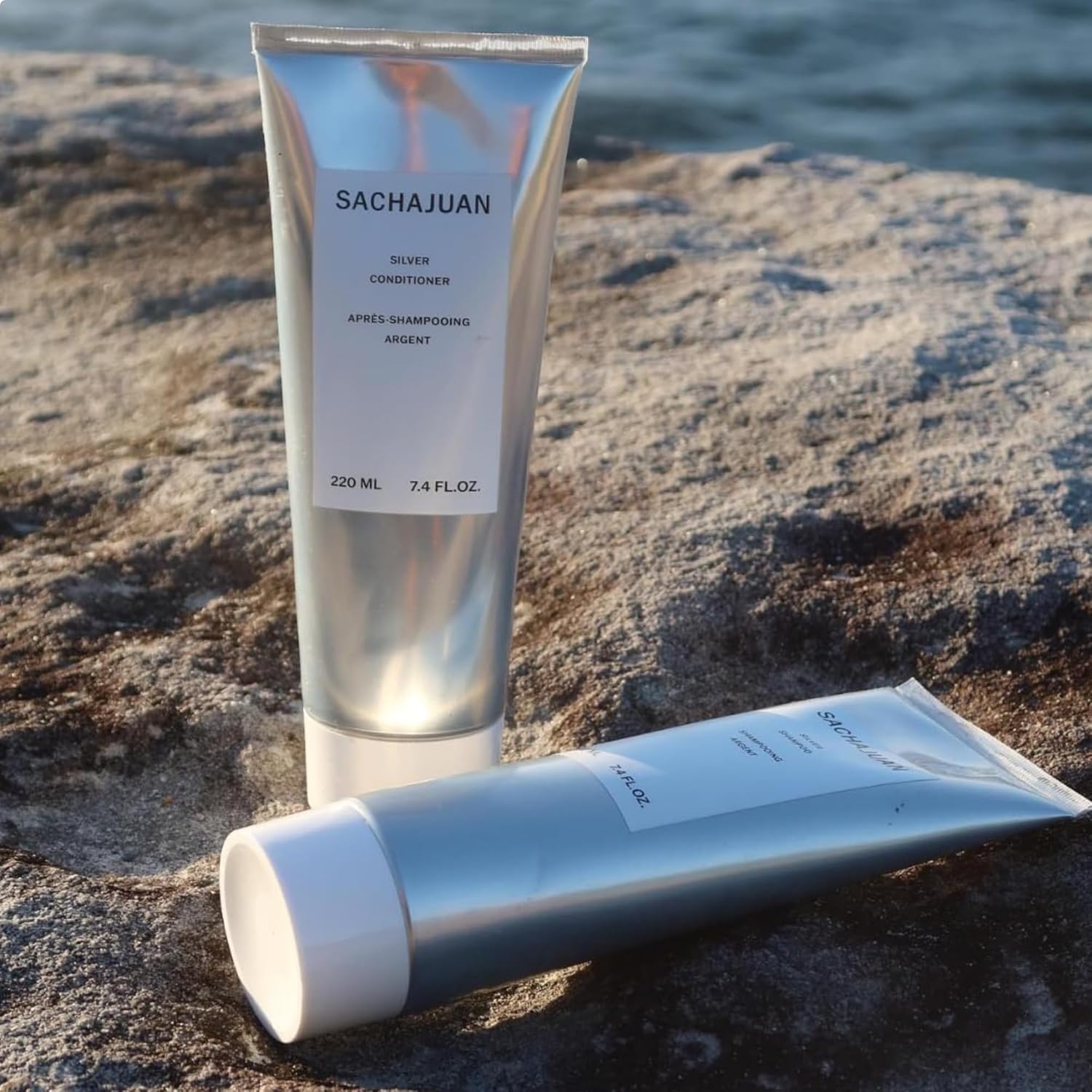 SACHAJUAN Silver Shampoo bottle for blonde and gray hair, featuring sleek packaging and purple-tinted shampoo inside.