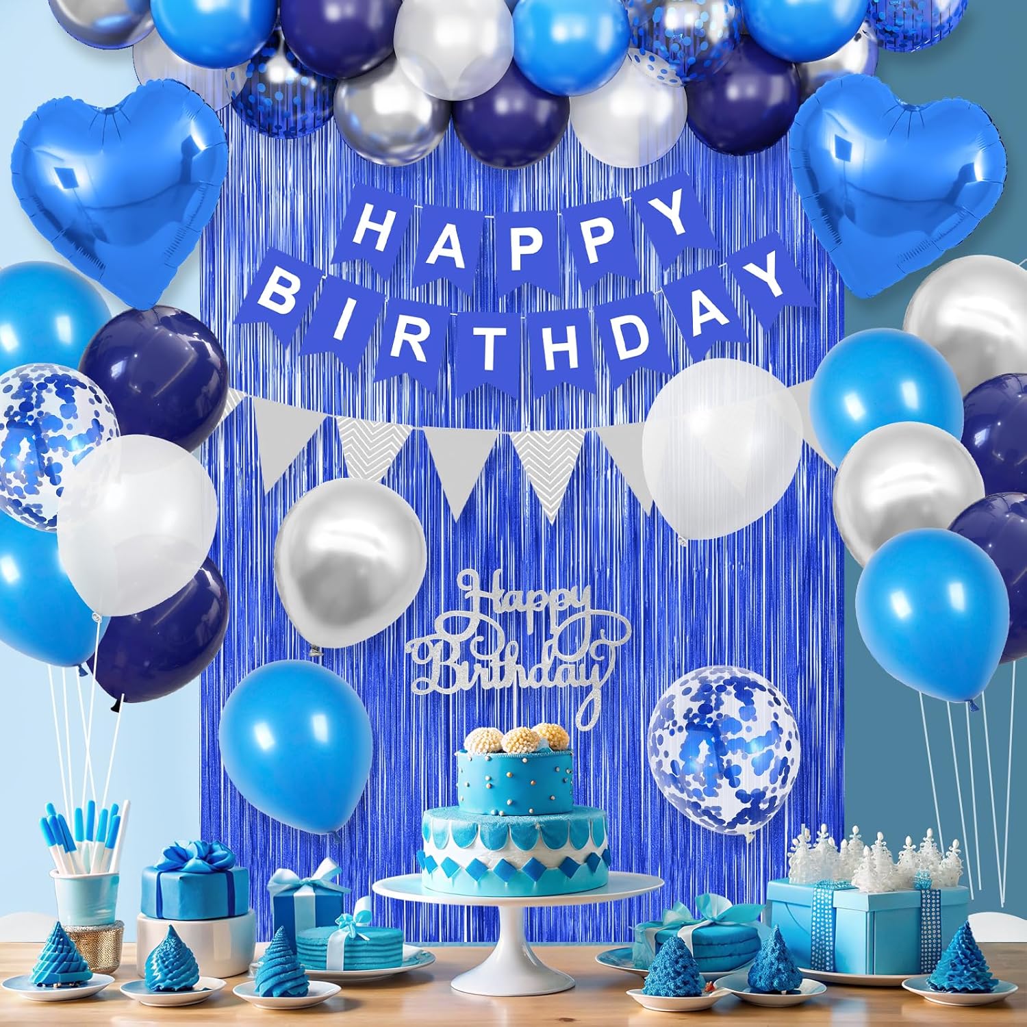 Blue and silver birthday decoration with navy blue and white balloons, including heart-shaped foil balloons for men's celebration.