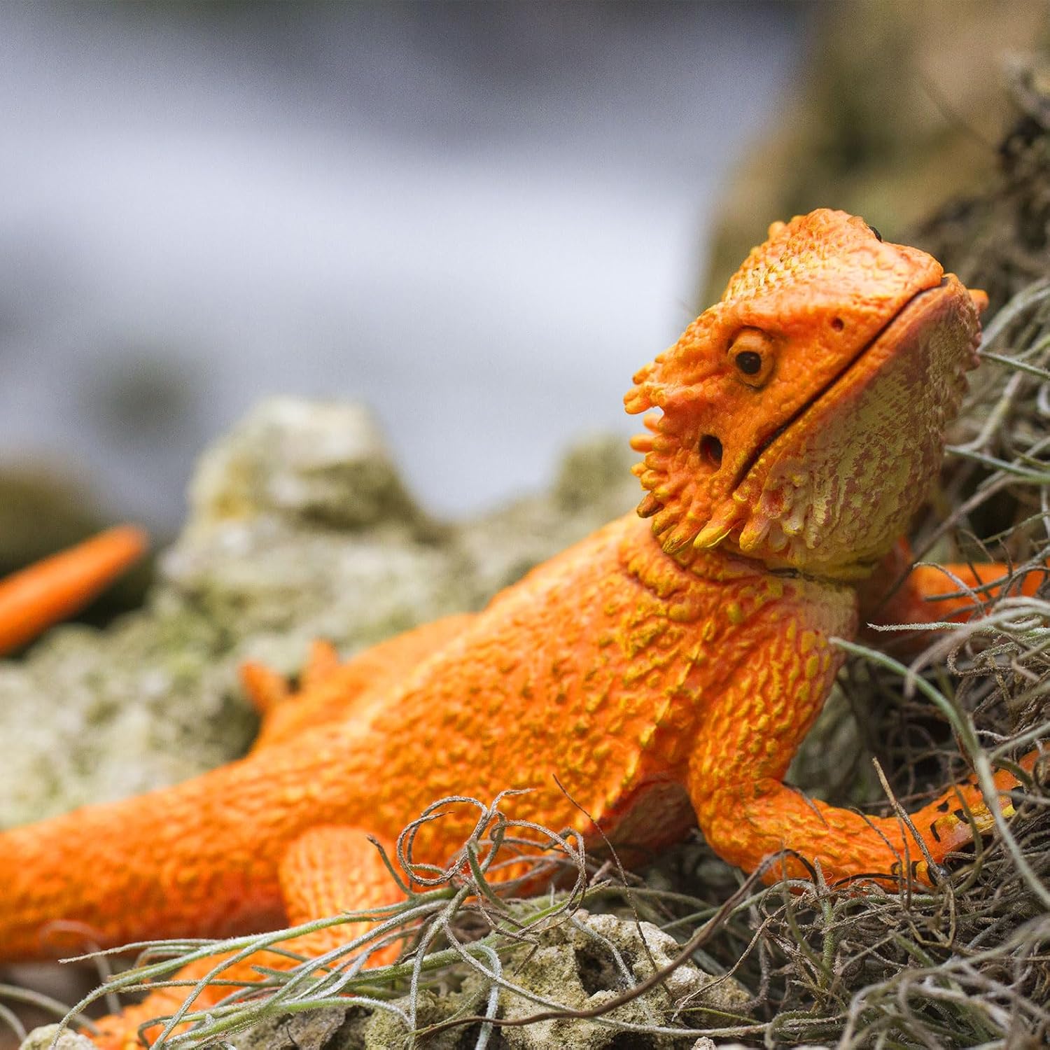 Safari Ltd. bearded dragon figurine, detailed 8.5-inch plastic model of a reptile, realistic texture and vibrant coloring.