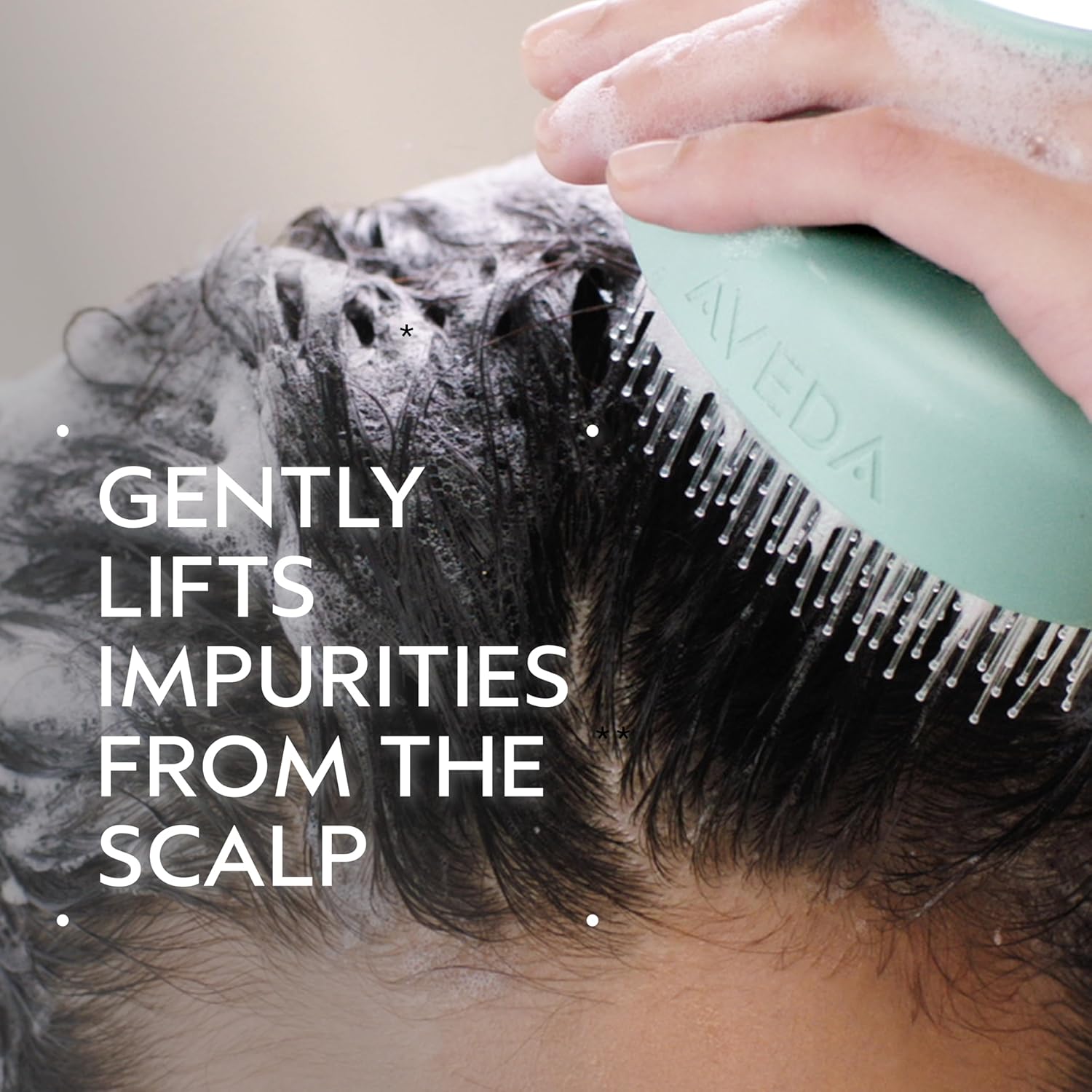 Elefair Aveda Scalp Solutions Stimulating Scalp Massager with exfoliating bristles for scalp stimulation and cleansing.