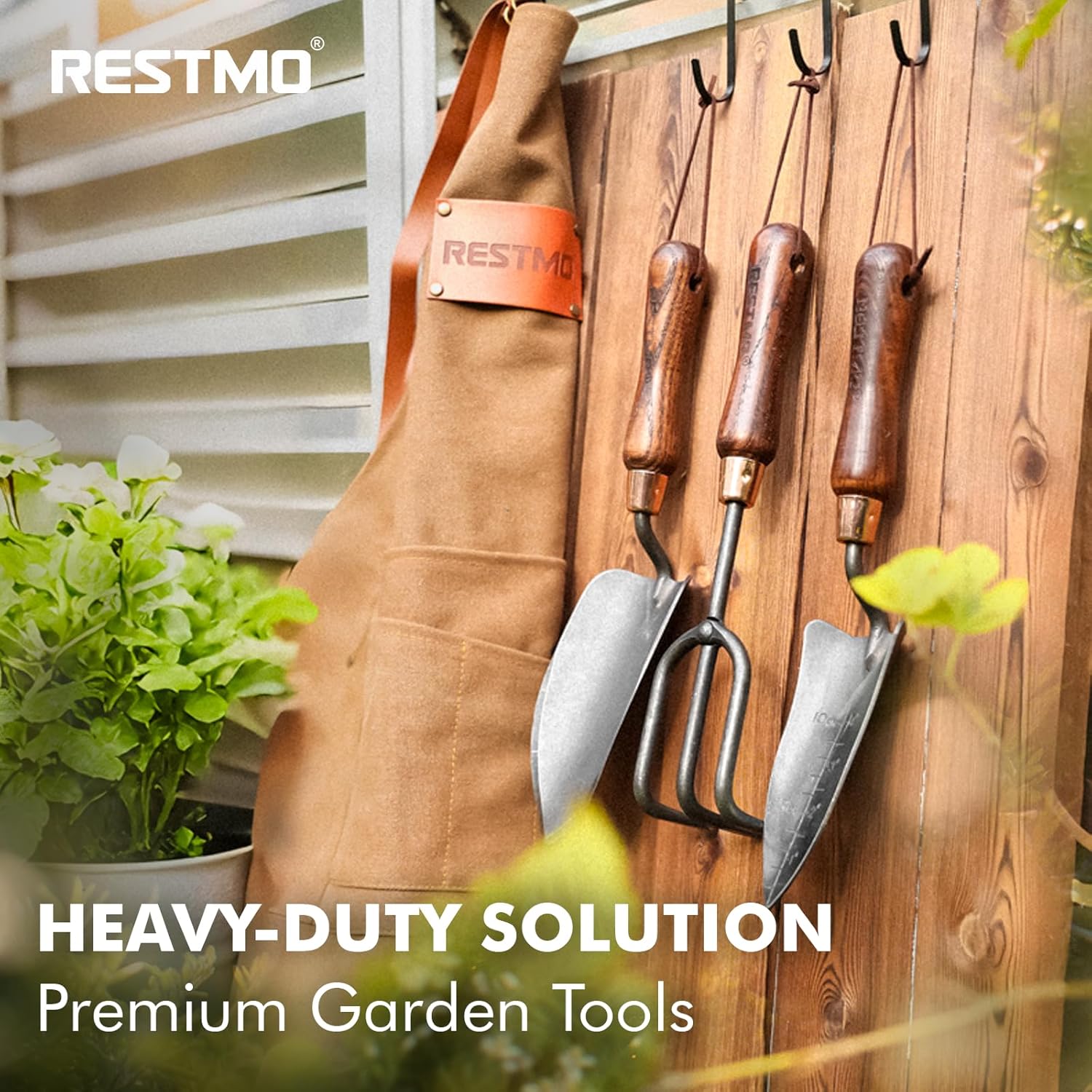 Restmo 3-in-1 heavy-duty gardening tools kit with premium carbon steel tools, including a trowel, pruners, and cultivator.