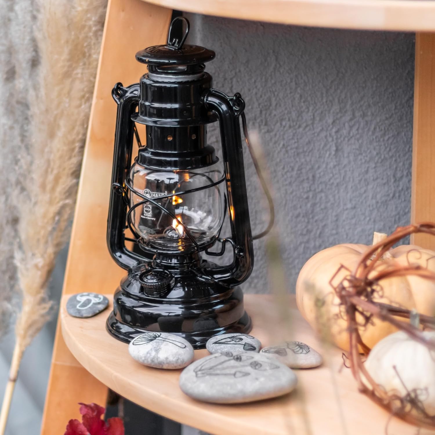 Feuerhand outdoor kerosene fuel lantern with weather-resistant design, German-made with a classic metal body and glass chimney.