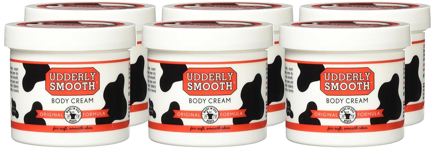 Udderly Smooth Body Cream moisturizer in a 6-pack, featuring creamy texture and soothing skin hydration.