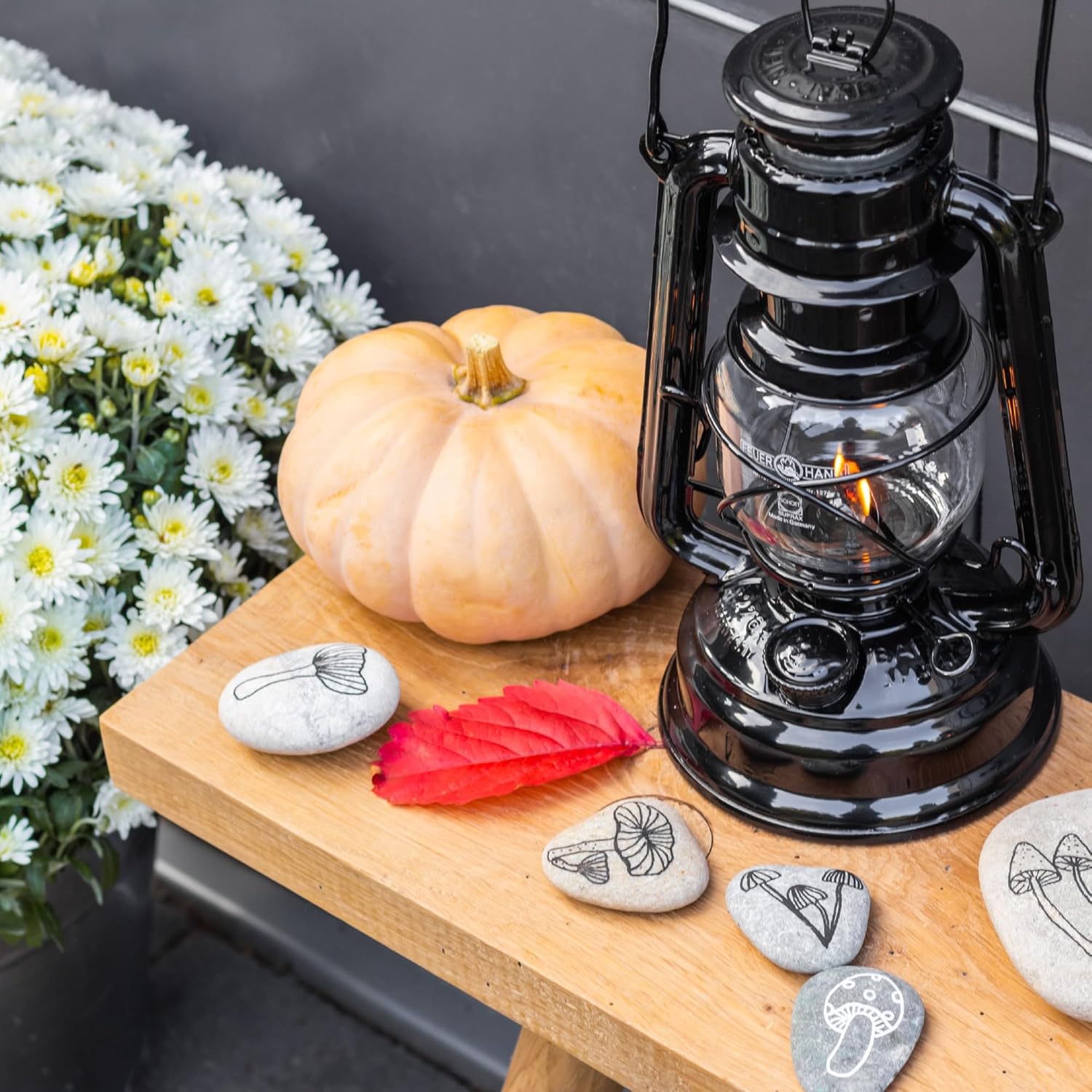 Feuerhand outdoor kerosene fuel lantern with weather-resistant design, German-made, featuring a classic metal construction and glass chimney.