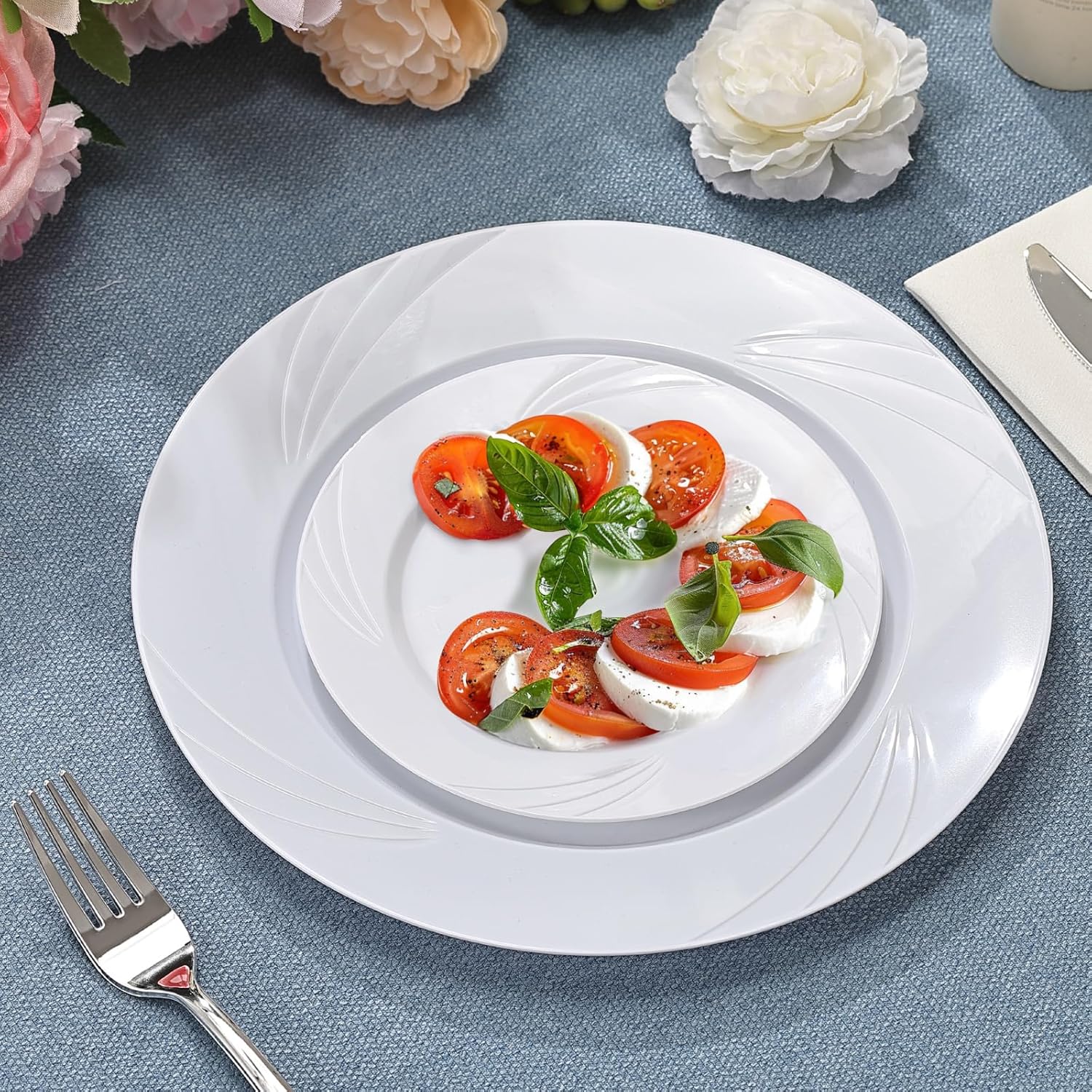 VajilaPhil 700-piece white swirl plastic dinnerware set for 100 guests, includes plates, bowls, and utensils, elegant disposable design
