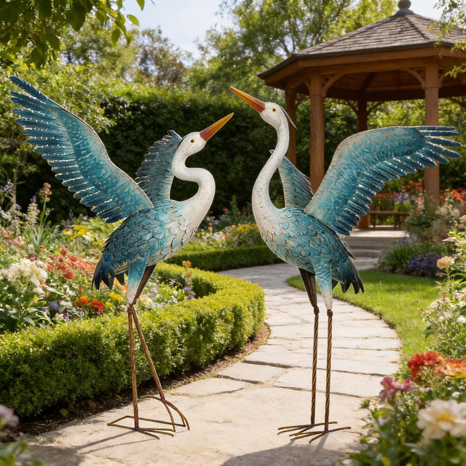 Two chisheen outdoor metal heron crane garden statues in white and blue, decorative yard art sculptures for outdoor spaces.