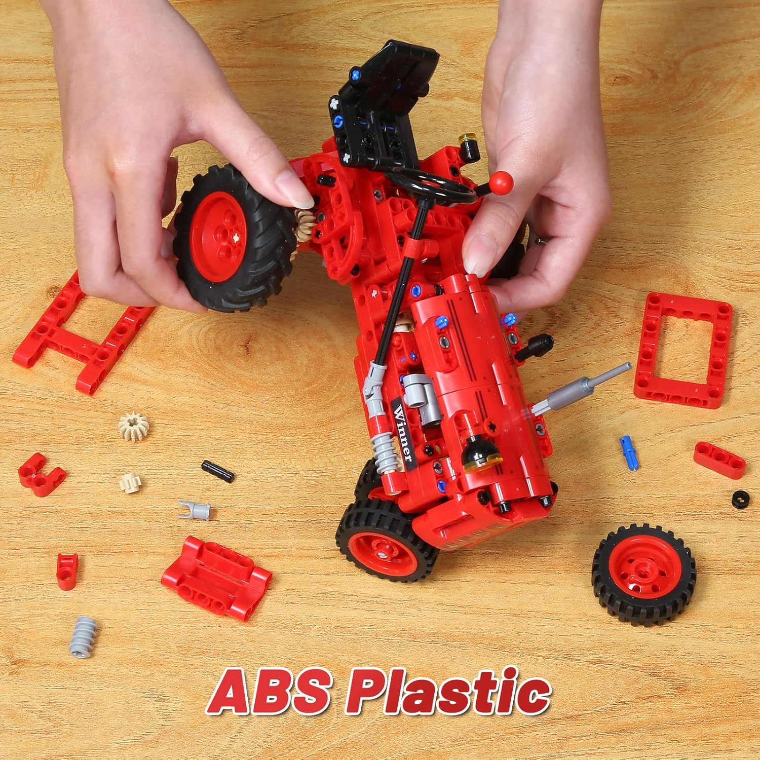 Red tractor building blocks set by WanJJXW featuring farm tractor toy construction kit for kids with colorful plastic pieces.