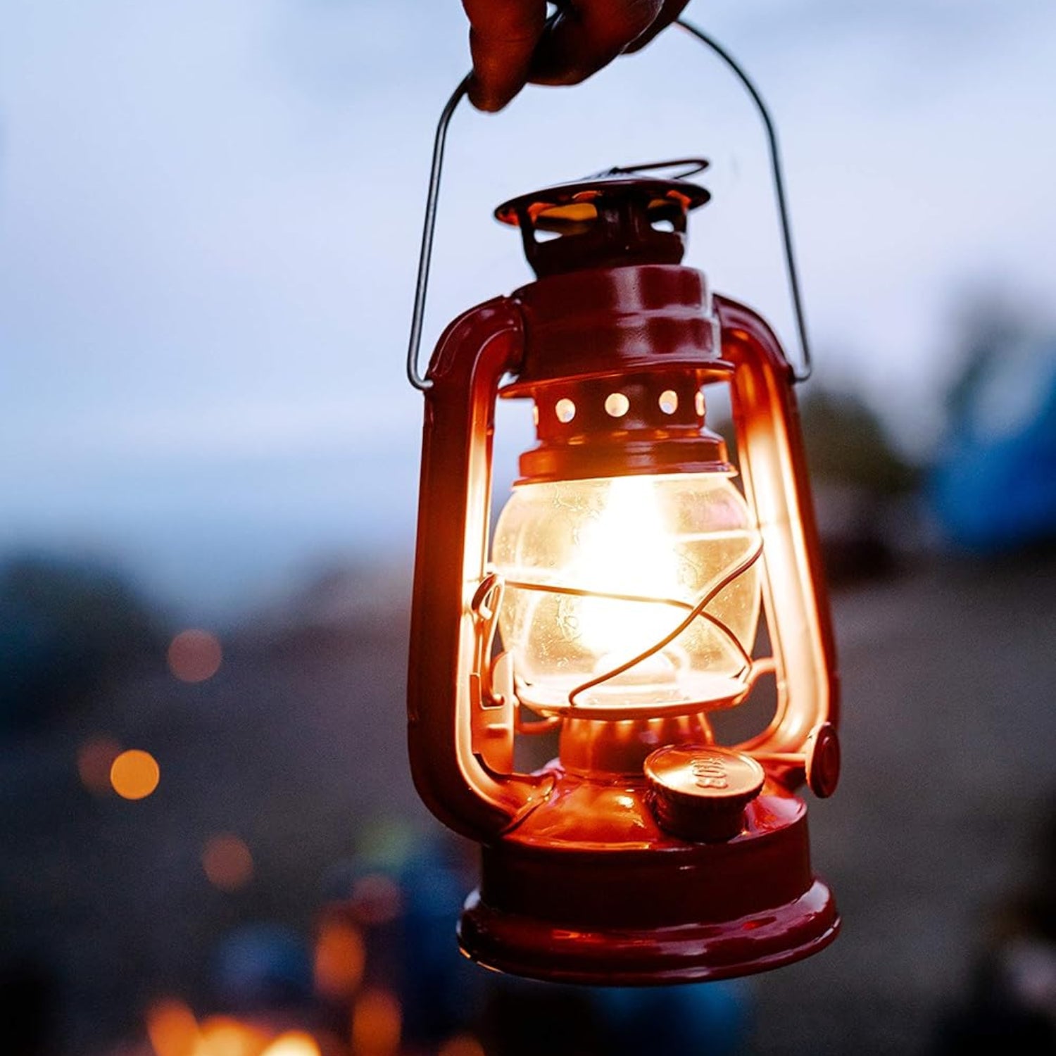 Stansport hurricane lantern with metal frame and glass chimney, classic kerosene oil lamp for outdoor or emergency lighting.