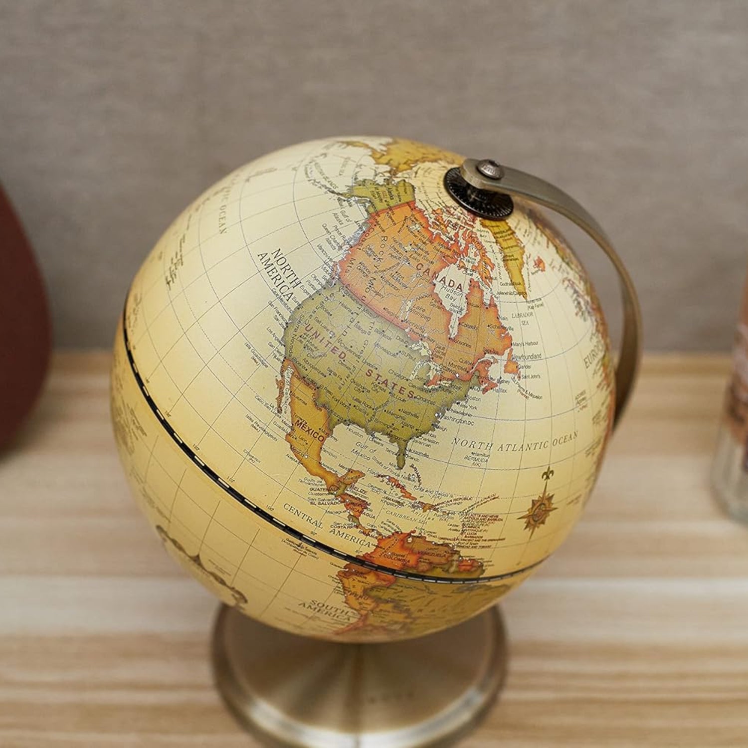 Annova antique globe with 5.5-inch diameter, featuring detailed geographic markings on a modern desktop stand.