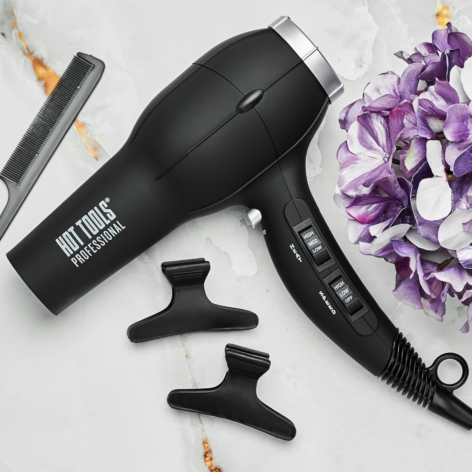 Hot Tools Pro Artist 1875W Turbo Ionic Dryer in black, featuring a sleek design and multiple heat settings for smooth, frizz-free blowouts.