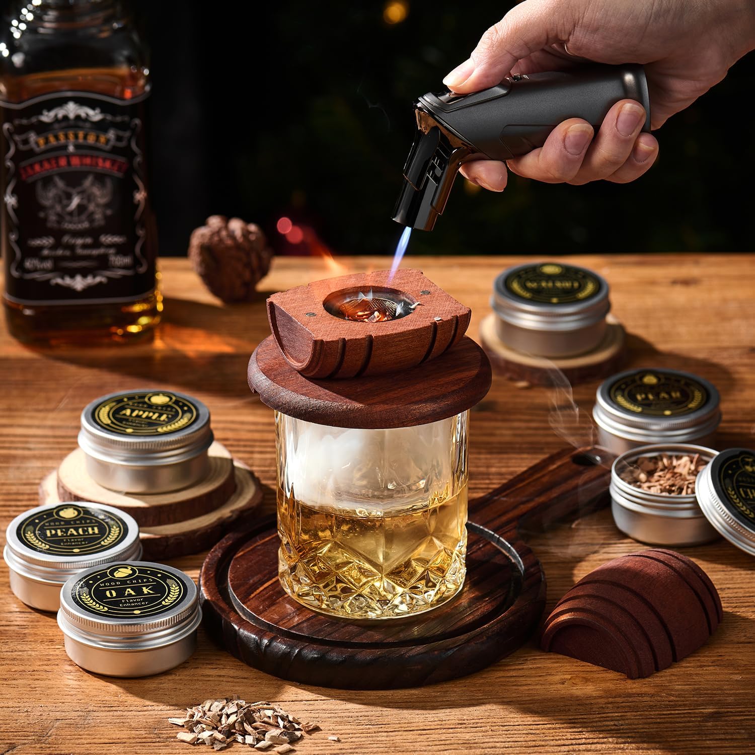 ComboJoy whiskey smoker kit with torch, 6 wood chip flavors, 2 glasses, and 2 ice ball molds for smoky whiskey tasting.