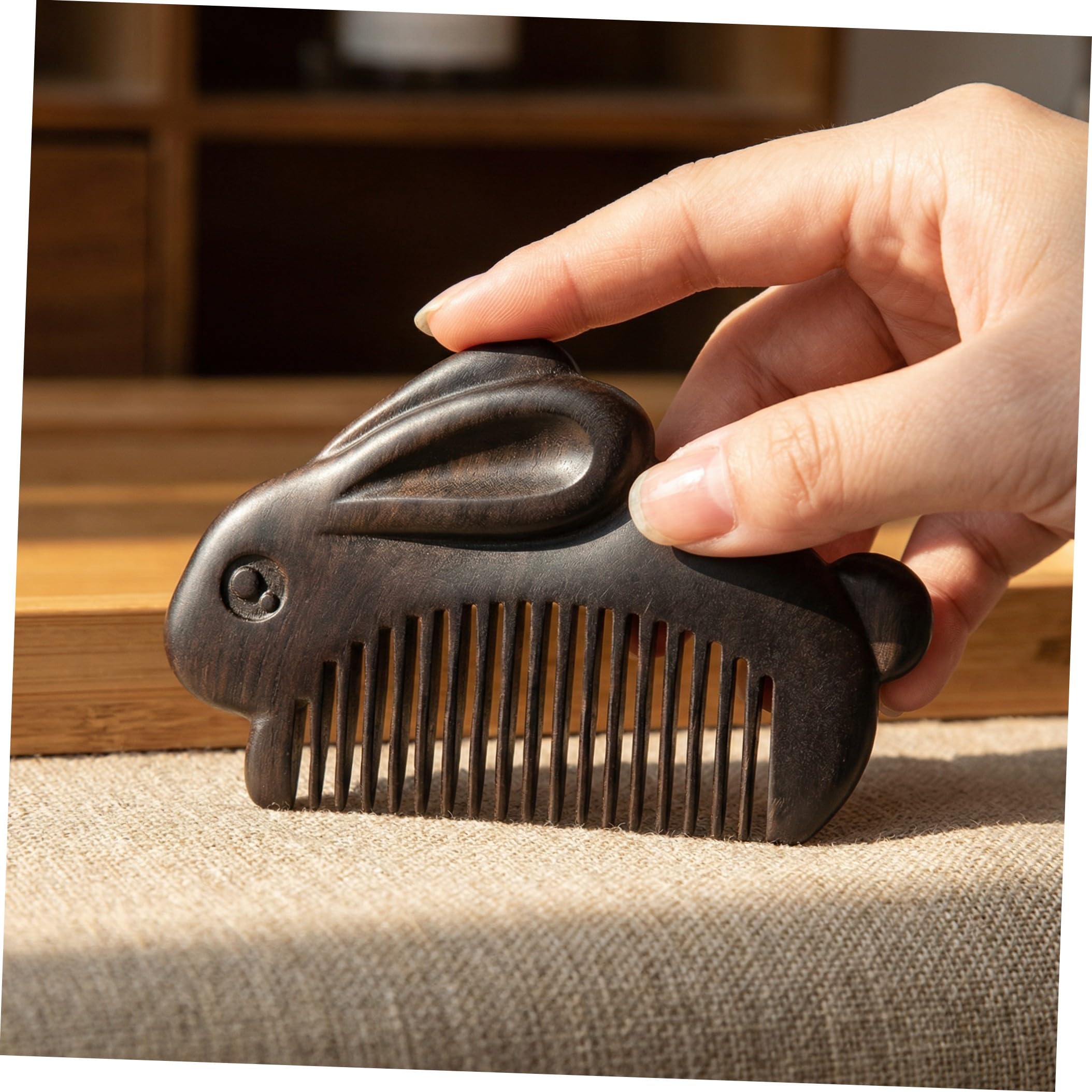 CATIEBYE small wooden hair comb with bunny design, portable handheld massage and detangling tool for scalp stimulation and hair care.