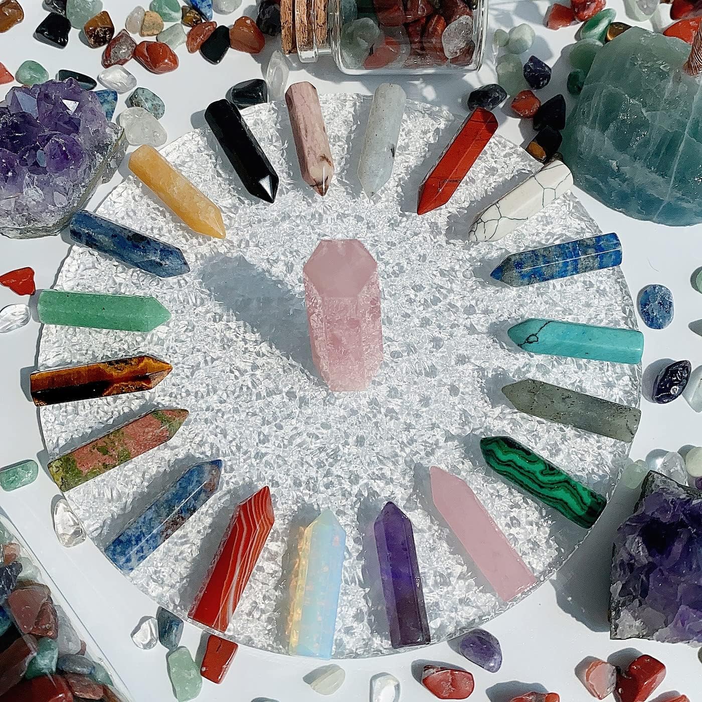 Set of 20 natural healing crystal stones, including amethyst and rose quartz, with wand-shaped crystals for spiritual wellness.