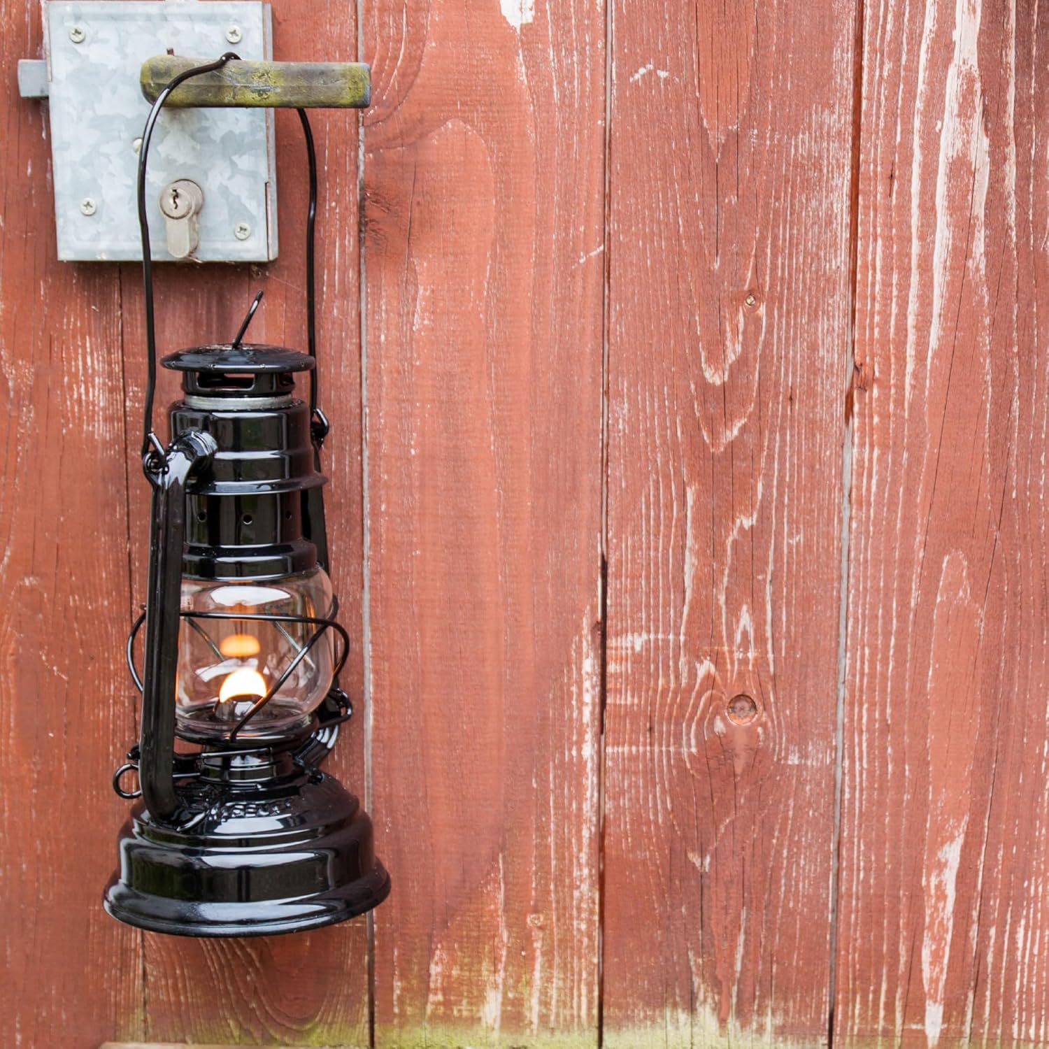 Feuerhand outdoor kerosene fuel lantern with weather-resistant design, German-made, featuring a classic metal construction and glass chimney.