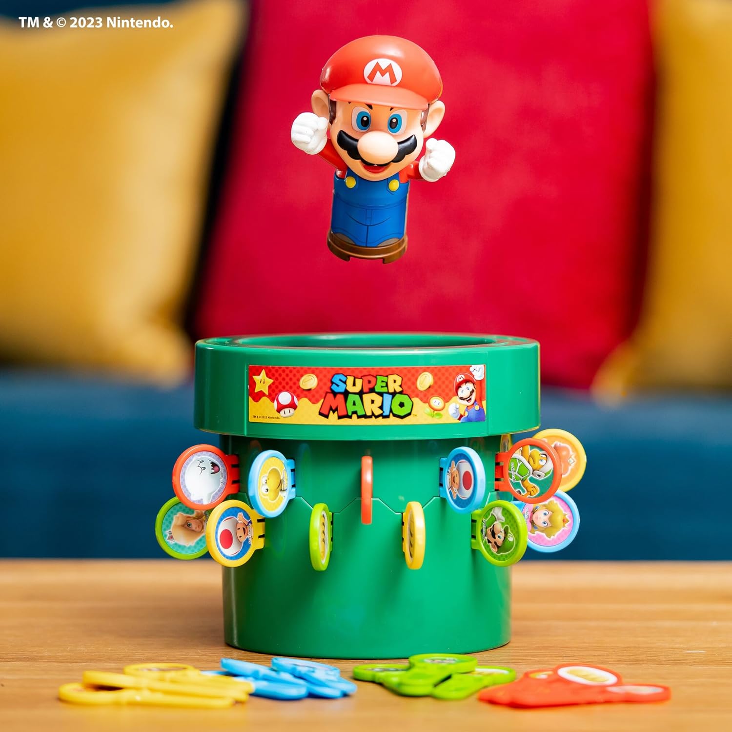 TOMY Pop Up Super Mario game set with colorful game board and characters for indoor recess or family game night.