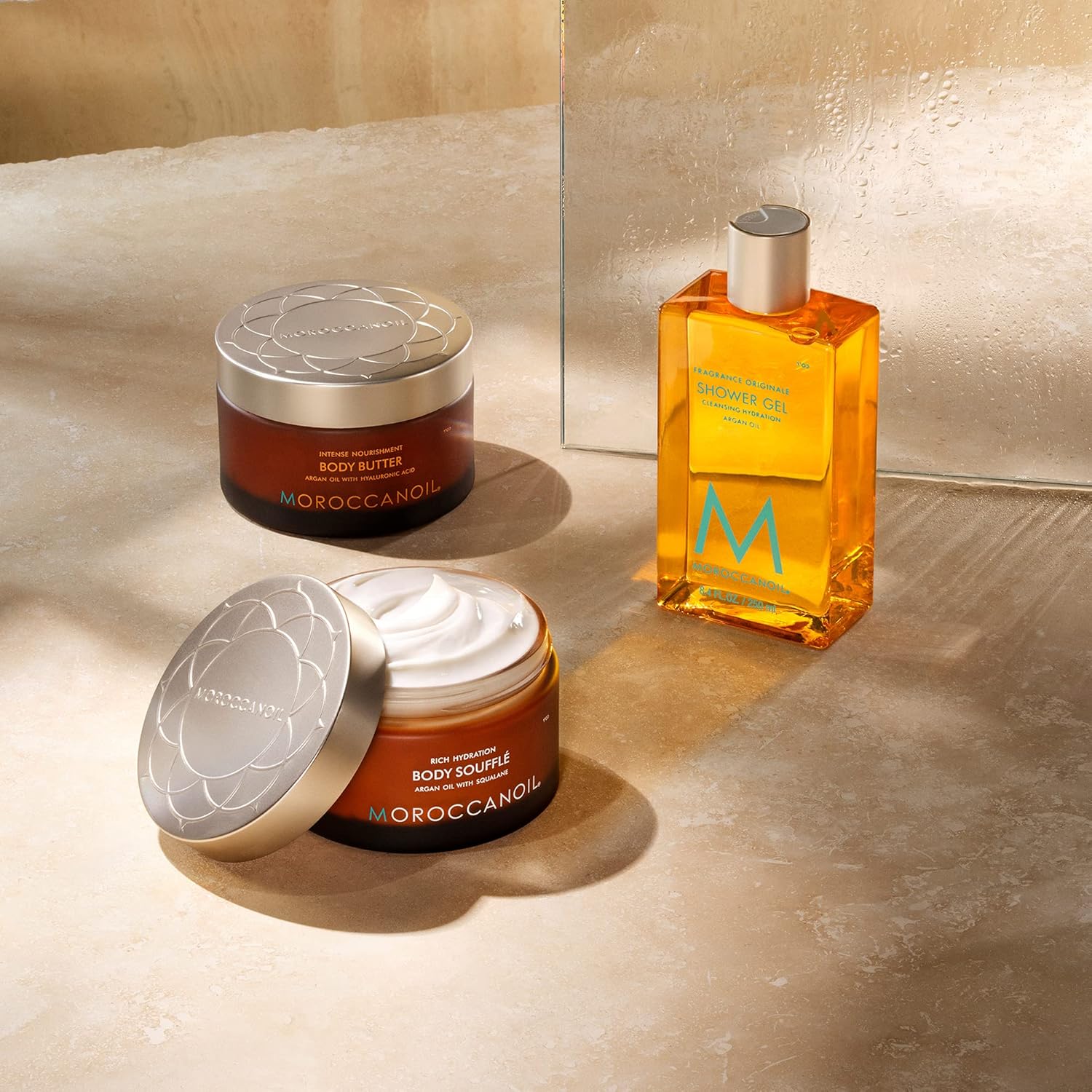 Moroccanoil Body Soufflé Originale in 6.7 fl oz jar, featuring rich, fluffy texture and elegant packaging with fragrance elements.