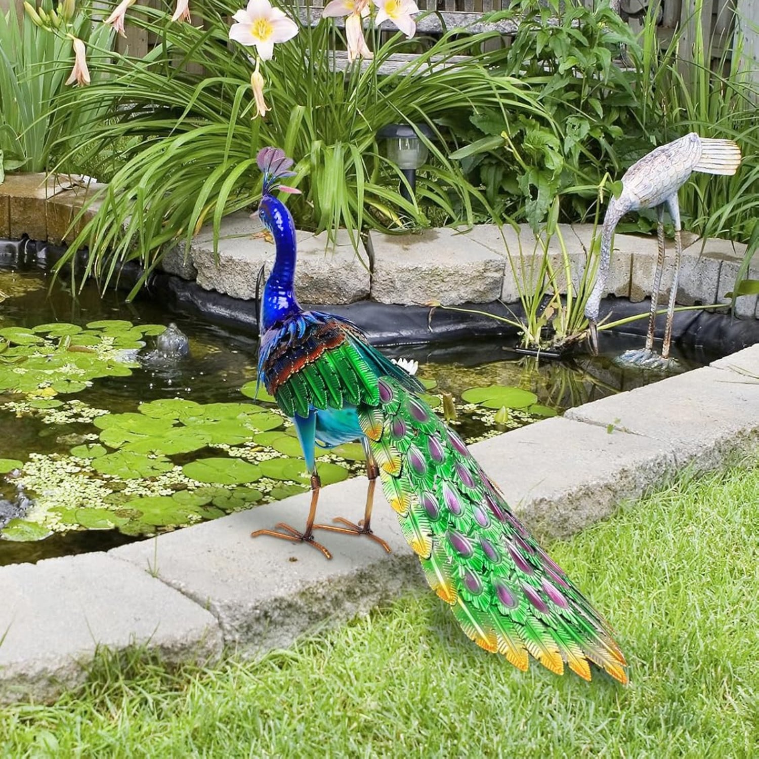 YEAHOME garden decor outdoor statue of a large 24.4-inch metal peacock standing in a garden setting