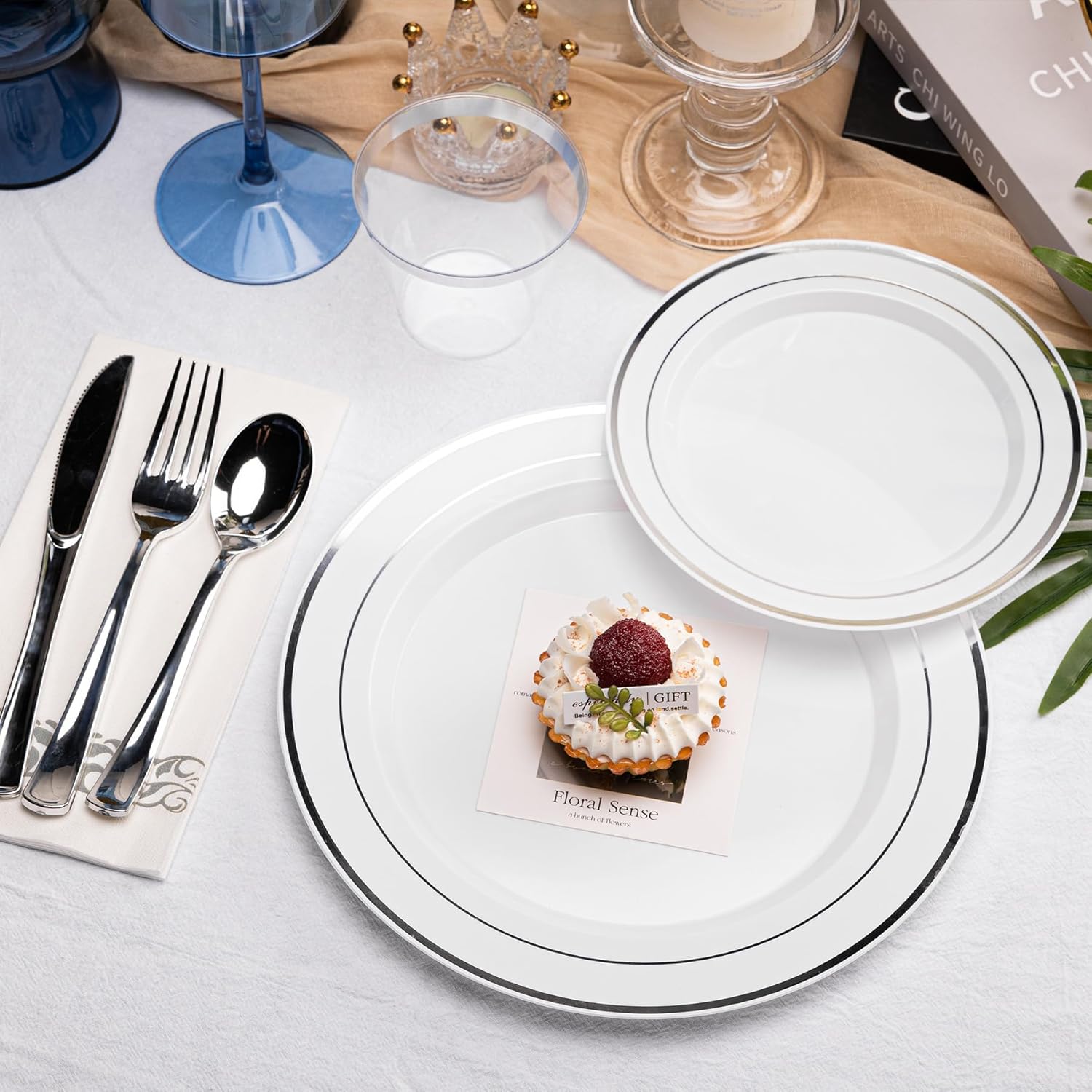 N9R 700-piece silver disposable dinnerware set including plates, cups, and utensils for 100 guests, white plastic design