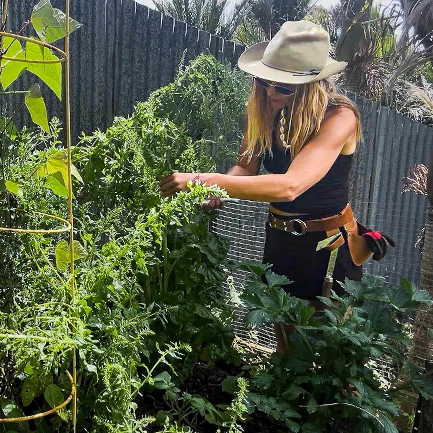 Gaucha Designs leather garden tool belt with multiple pouches, ideal for gardening and organizing garden tools for women.