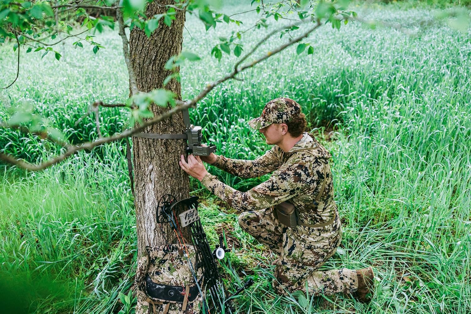 Tactacam REVEAL X Gen 3.0 cellular trail camera capturing HD photos and videos, mounted outdoors in natural surroundings.
