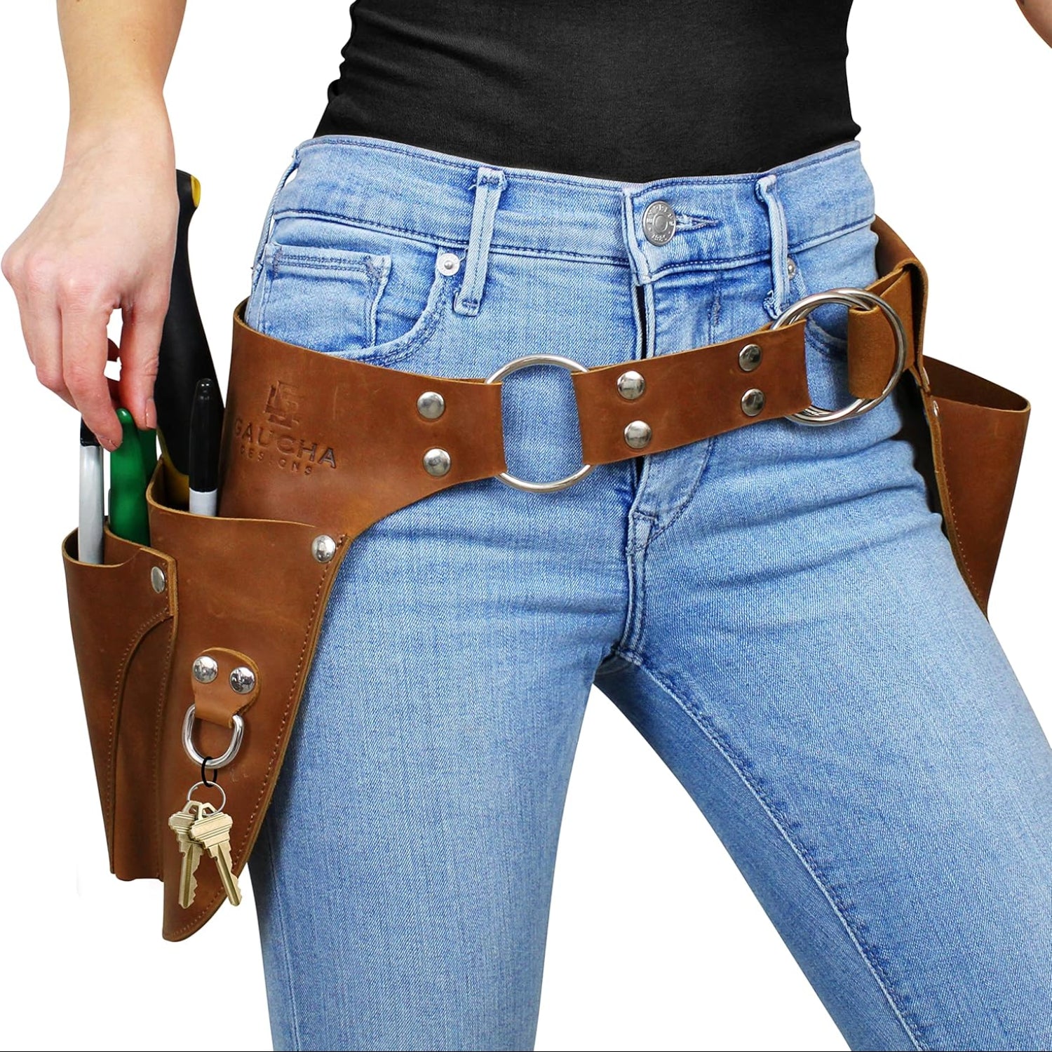 Leather garden tool belt by Gaucha Designs with multiple pouches, ideal for organizing gardening tools and gifts for women.