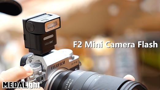 MEDALight F2 Mini Camera Flash with 2.4GHz wireless off-camera flash, compact design, and adjustable settings for photography.