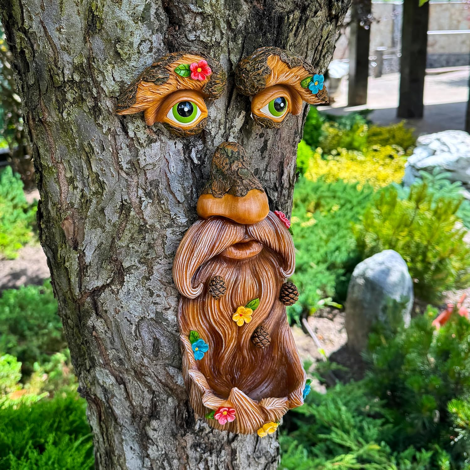 Outdoor bird feeder featuring a tree-shaped face decor with an old man face design by Mood Lab, perfect for garden decoration.